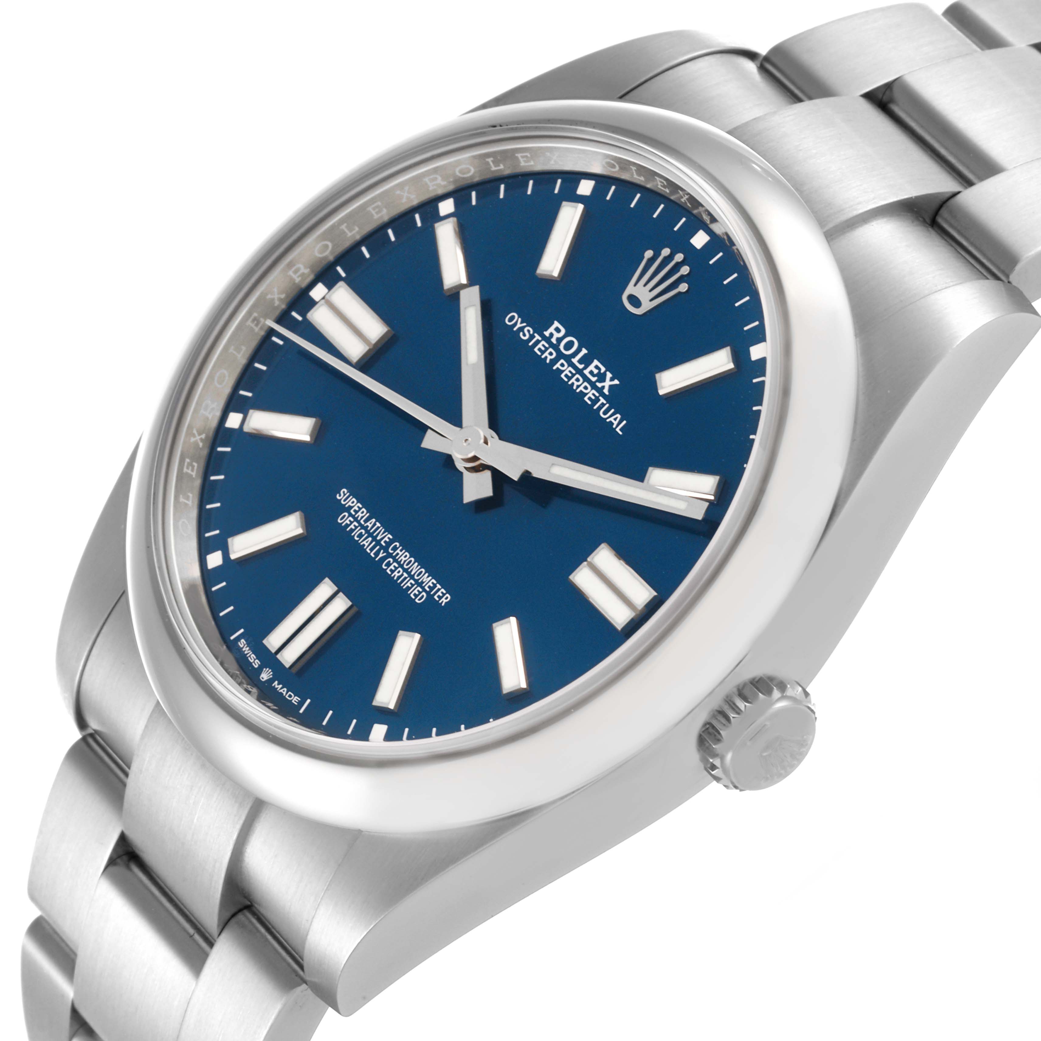 The Rolex Oyster Perpetual 124300 Men's Stainless Steel Blue Dial 124300 Men's Stainless Steel Blue Dial watch is shown from a slightly angled top view, displaying the face, bezel, crown, and part of the bracelet.