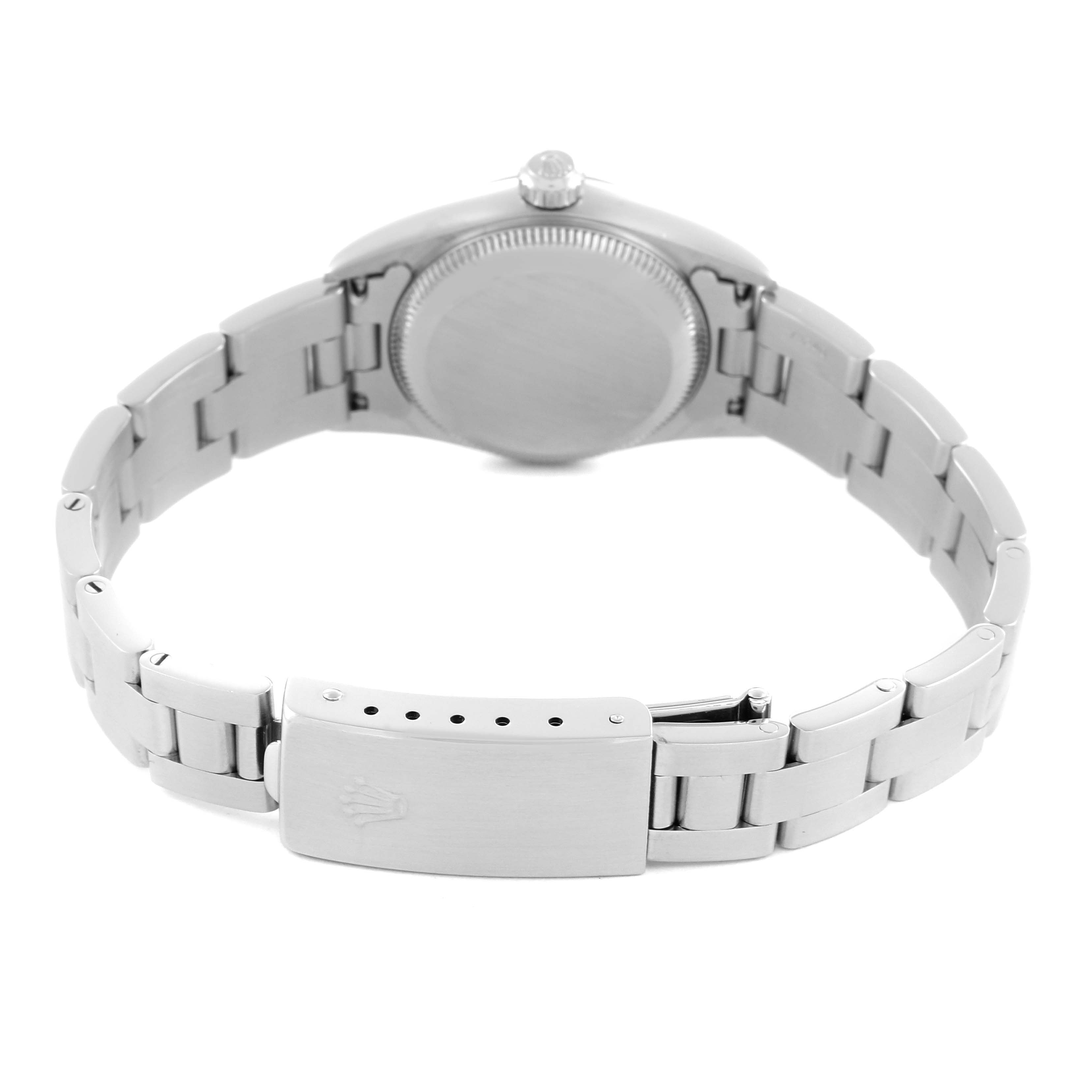 The Rolex Oyster Perpetual 76080 Women's Stainless Steel Pink Dial 76080 Women's Stainless Steel Pink Dial watch is shown from the back, highlighting the case back and bracelet with clasp.