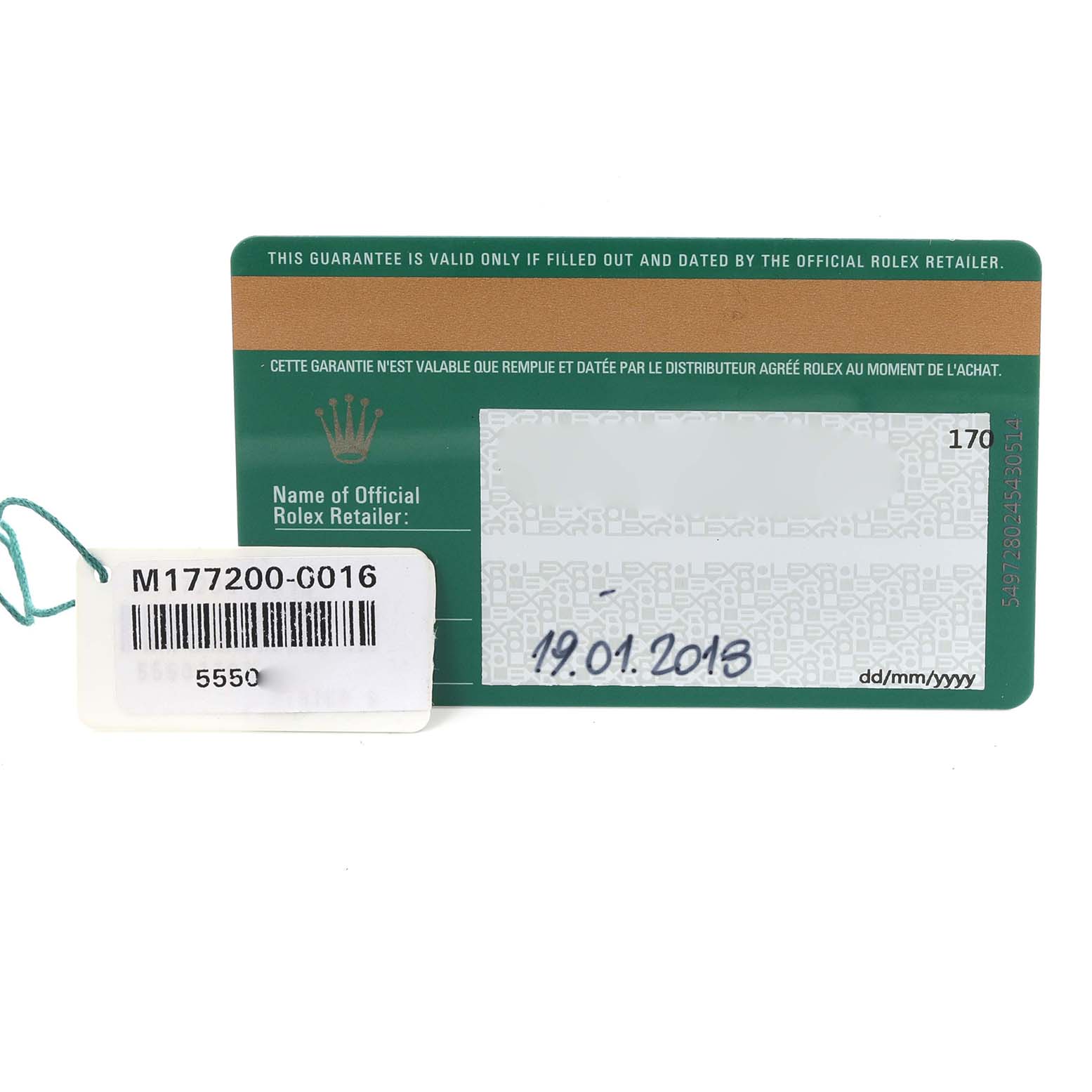 The image shows a Rolex warranty card and a tag for a Mid-Size model, positioned front-facing.