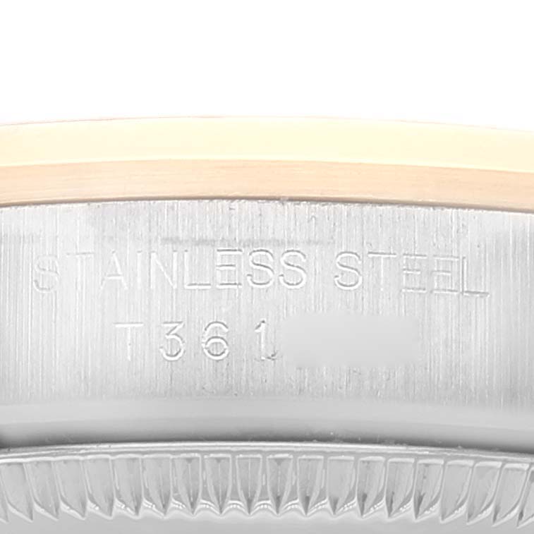 The image shows a close-up of the stainless steel case back and part of the bezel of a Rolex Oyster Perpetual 67183 Women's Steel and Gold (two tone) Grey Dial 67183 Women's Steel and Gold (two tone) Grey Dial watch.