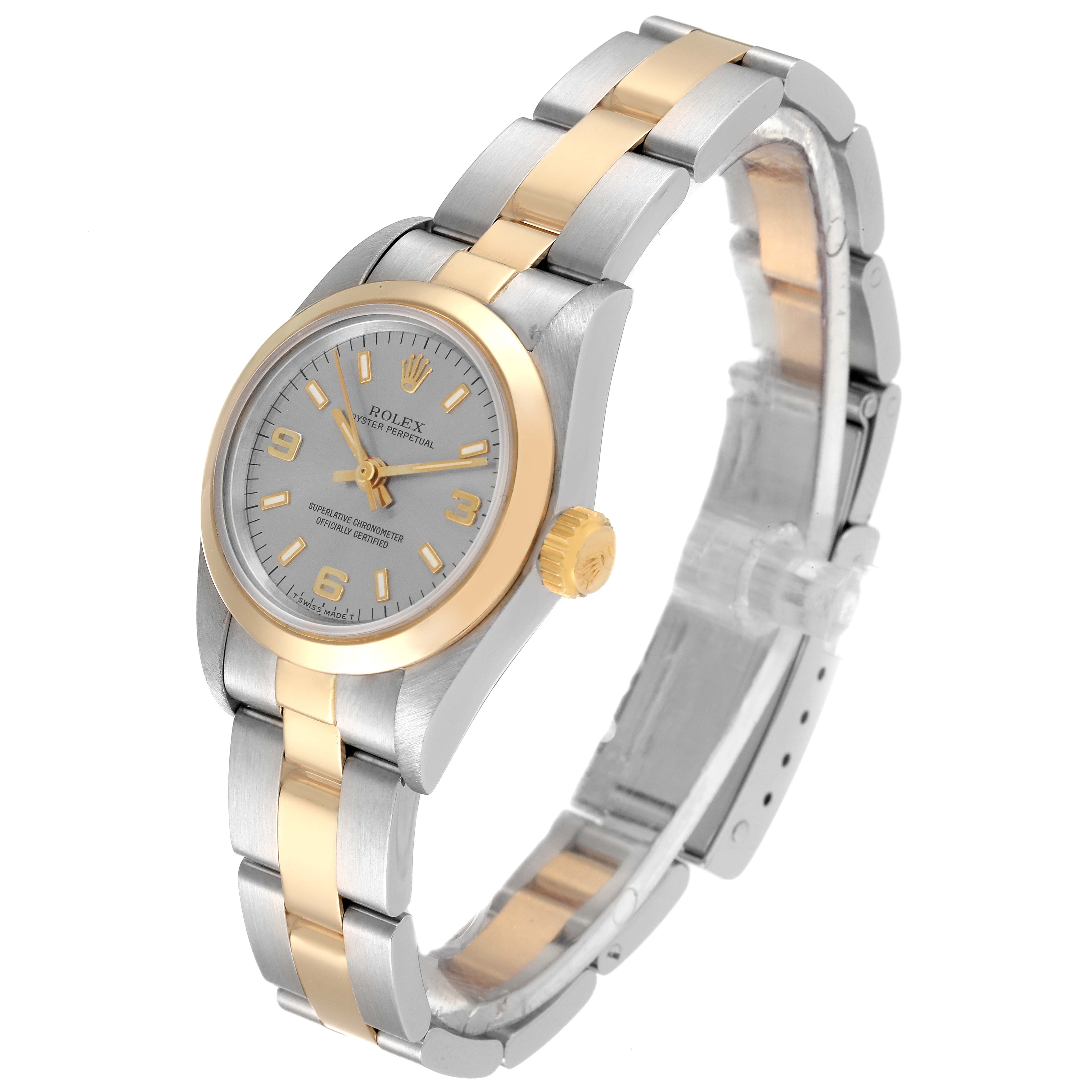 The Rolex Oyster Perpetual 67183 Women's Steel and Gold (two tone) Grey Dial 67183 Women's Steel and Gold (two tone) Grey Dial watch is shown at a three-quarter angle, highlighting its two-tone bracelet, dial, bezel, and crown.