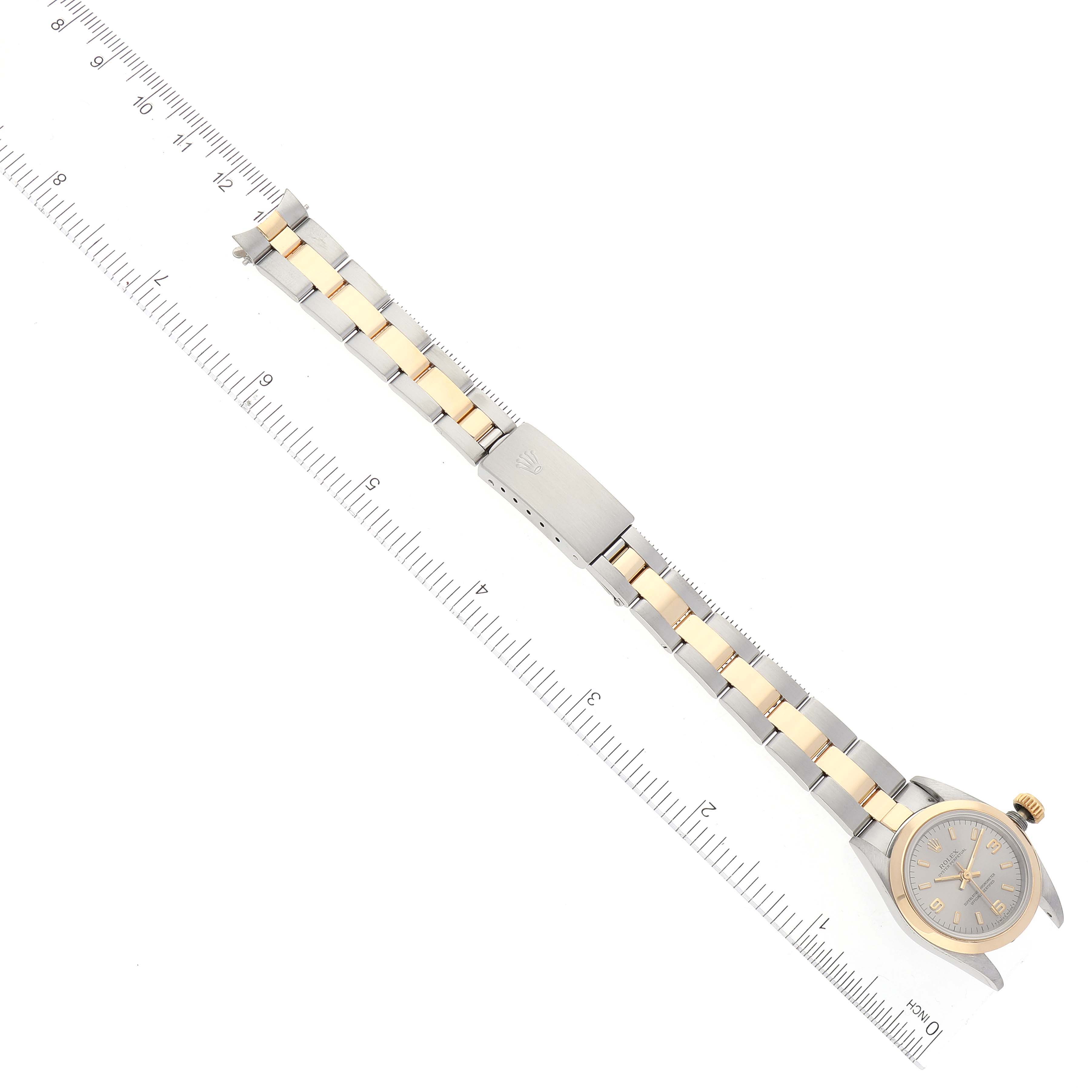 The image shows a Rolex Oyster Perpetual 67183 Women's Steel and Gold (two tone) Grey Dial 67183 Women's Steel and Gold (two tone) Grey Dial watch laid flat, with the bracelet and clasp fully extended.