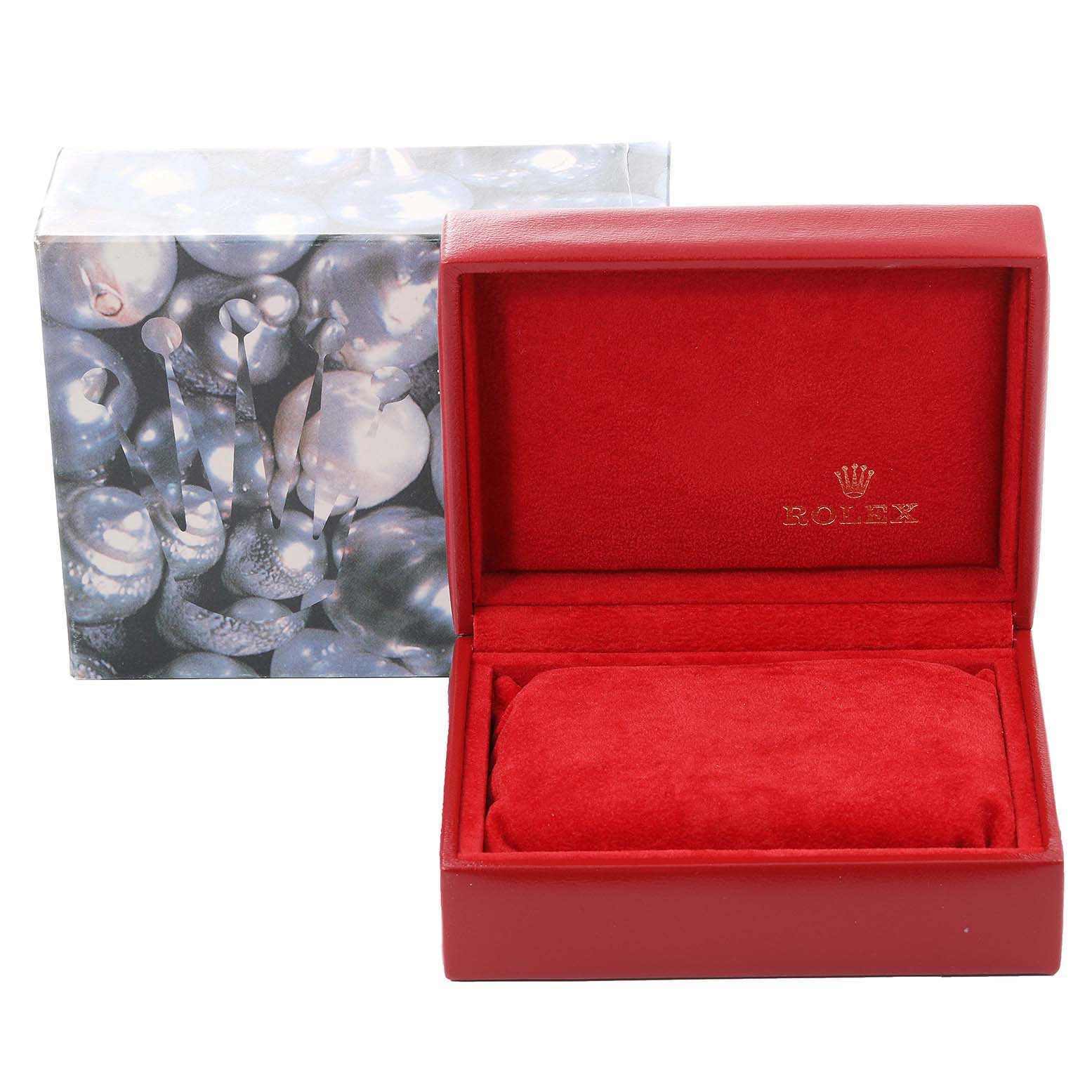 The image shows a red Rolex watch box for the President model, with an outer decorative box in the background.