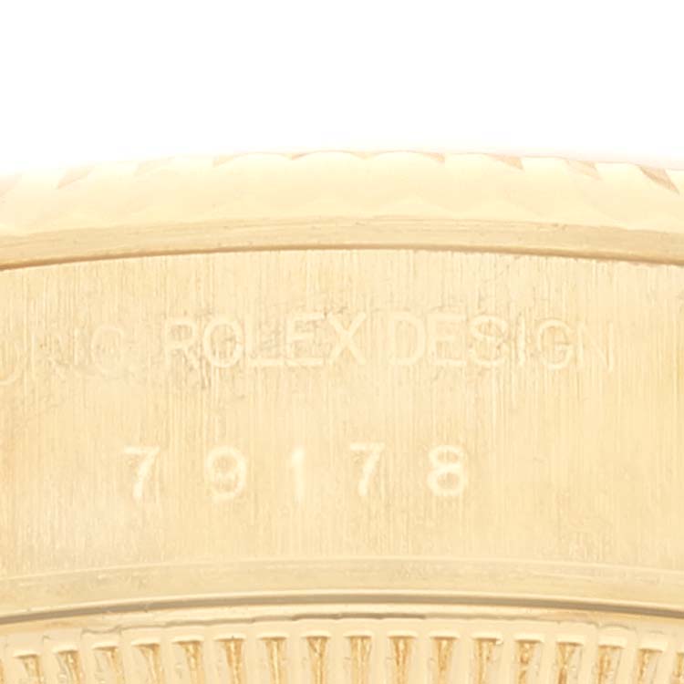 The image shows a close-up of the side of a Rolex President 79178 Women
s Yellow Gold Champagne Dial 79178 Women
s Yellow Gold Champagne Dial watch, displaying the model number "79178" and "ORIG ROLEX DESIGN."