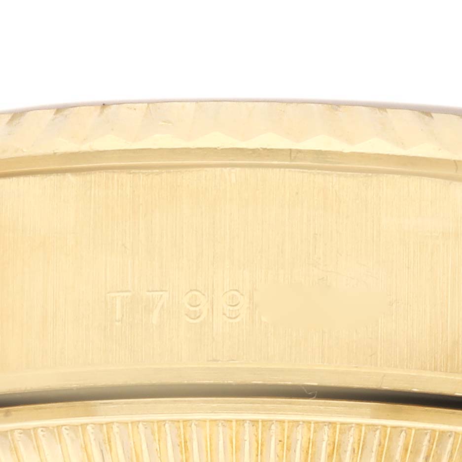 The image shows a close-up of the side and edge of the bezel of a Rolex President 69178 Women's Yellow Gold Champagne Dial 69178 Women's Yellow Gold Champagne Dial watch.