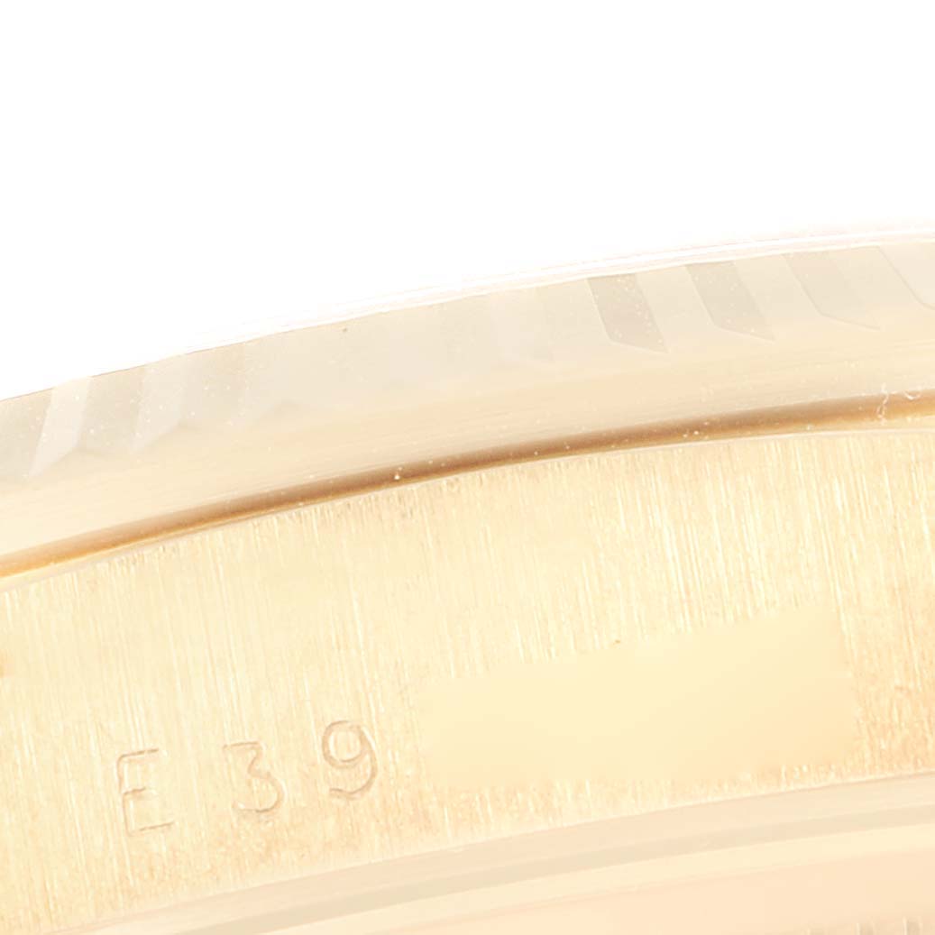 This image shows a close-up of the engraved case back of the President model by Rolex.