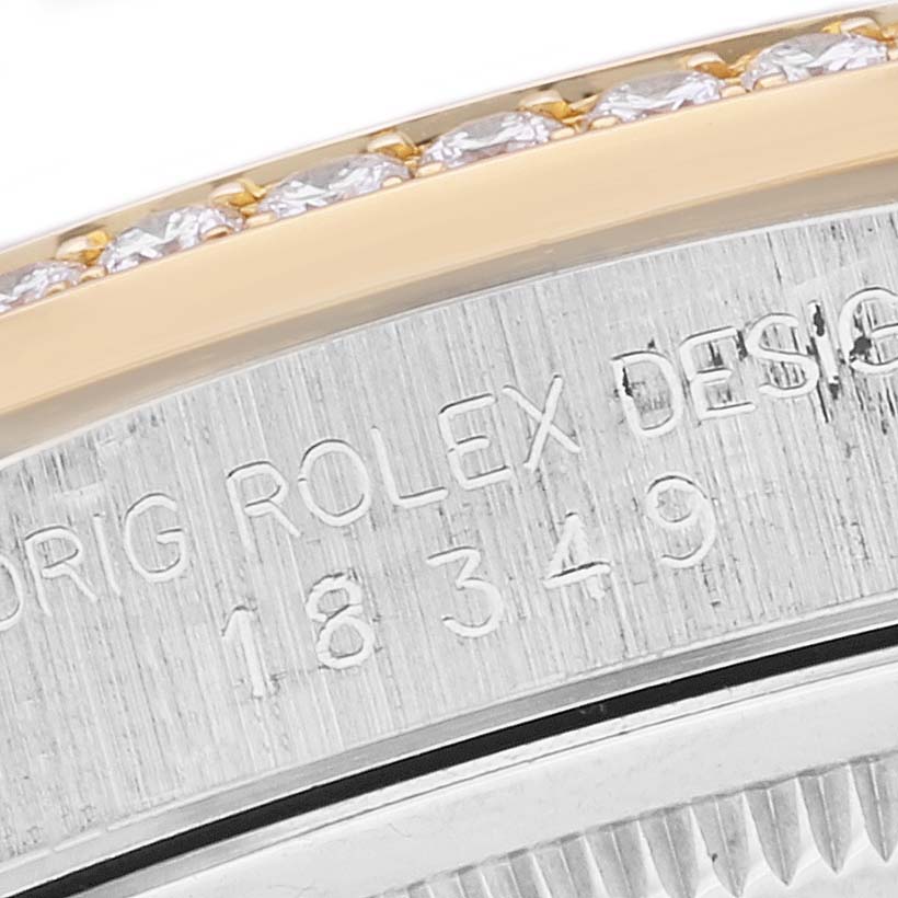 A close-up of the Rolex President 18349 Men's Steel and Gold (two tone) Champagne Dial 18349 Men's Steel and Gold (two tone) Champagne Dial model watch displaying part of the bezel and engraved model number "18349."