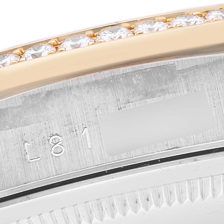 This image shows a close-up of the bezel, diamonds, and part of the case back of the Rolex President 18349 Men's Steel and Gold (two tone) Champagne Dial 18349 Men's Steel and Gold (two tone) Champagne Dial model watch.