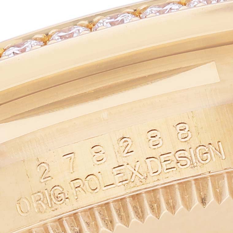 This image shows a close-up of the case back and part of the bezel of a Rolex President 278288 Women's Yellow Gold Mother of Pearl Dial 278288 Women's Yellow Gold Mother of Pearl Dial model watch, displaying serial numbers and design details.