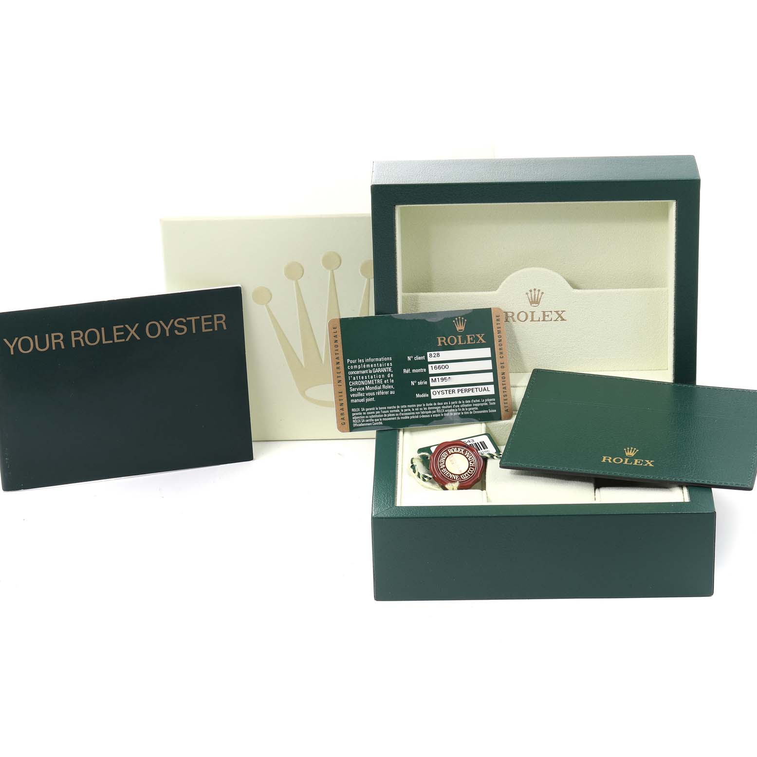 The image shows the packaging, warranty card, and manuals for the Rolex Sea-Dweller 16600 Men
s Stainless Steel Black Dial 16600 Men
s Stainless Steel Black Dial watch, all arranged together.