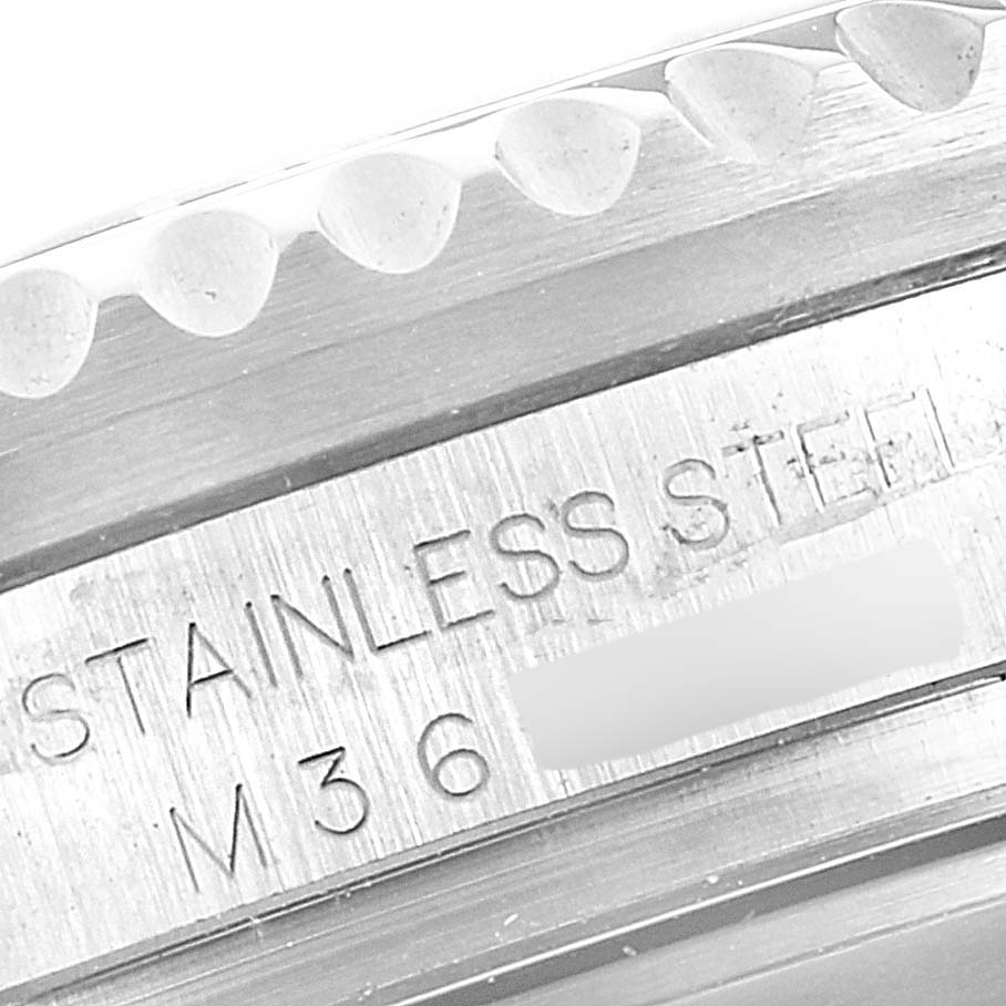 The image shows a close-up of the edge and stainless steel inscription on the case back of a Rolex Sea-Dweller 16600 Men
s Stainless Steel Black Dial 16600 Men
s Stainless Steel Black Dial watch.