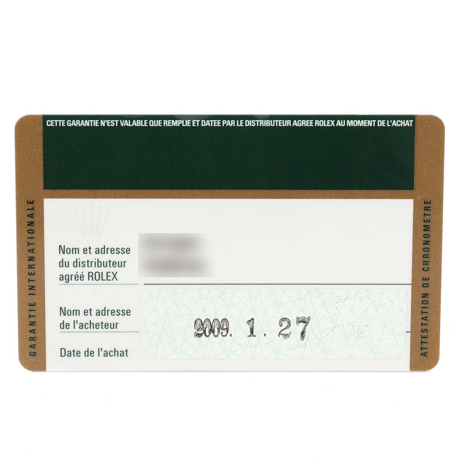 This image shows the warranty card for the Rolex Sea-Dweller 16600 Men
s Stainless Steel Black Dial 16600 Men
s Stainless Steel Black Dial watch viewed from a top-down angle.