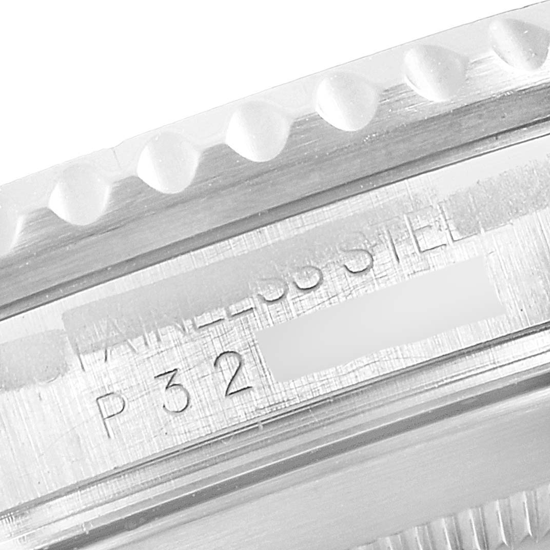 This close-up image shows the engraved edge and part of the bezel of a Rolex Submariner 16610 Men
s Stainless Steel Black Dial 16610 Men
s Stainless Steel Black Dial watch.