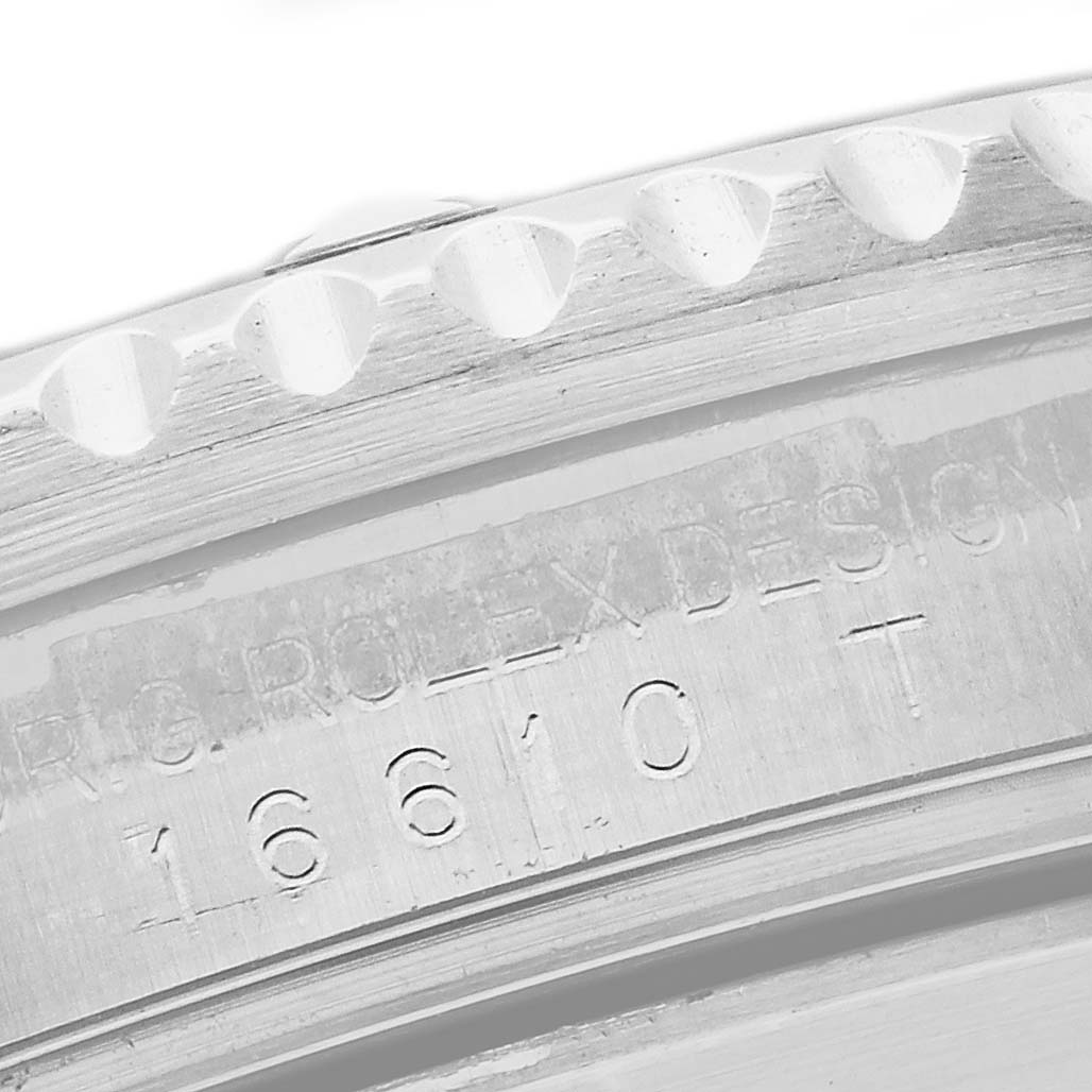 The image shows a close-up of the case edge and engraved model number on a Rolex Submariner 16610 Men's Stainless Steel Black Dial 16610 Men's Stainless Steel Black Dial.