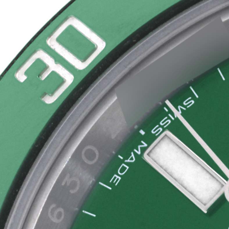 The image shows a close-up of the bezel and dial of a Rolex Submariner 116610LV Men's Stainless Steel Green Dial 116610LV Men's Stainless Steel Green Dial, focusing on the "30" mark and text.