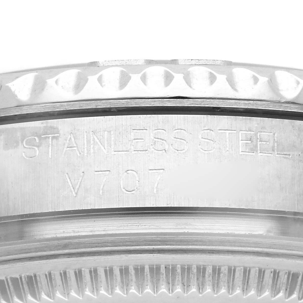 The image shows a close-up of the brushed stainless steel bezel edge of a Rolex Yacht-Master 168622 Men's Stainless Steel Grey Dial 168622 Men's Stainless Steel Grey Dial watch, highlighting the engraving.