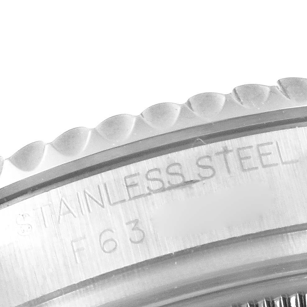 This image shows a close-up of the Rolex Yacht-Master 168622 Men
s Stainless Steel Silver Dial 168622 Men
s Stainless Steel Silver Dial
s stainless steel bezel with part of the engraved text.