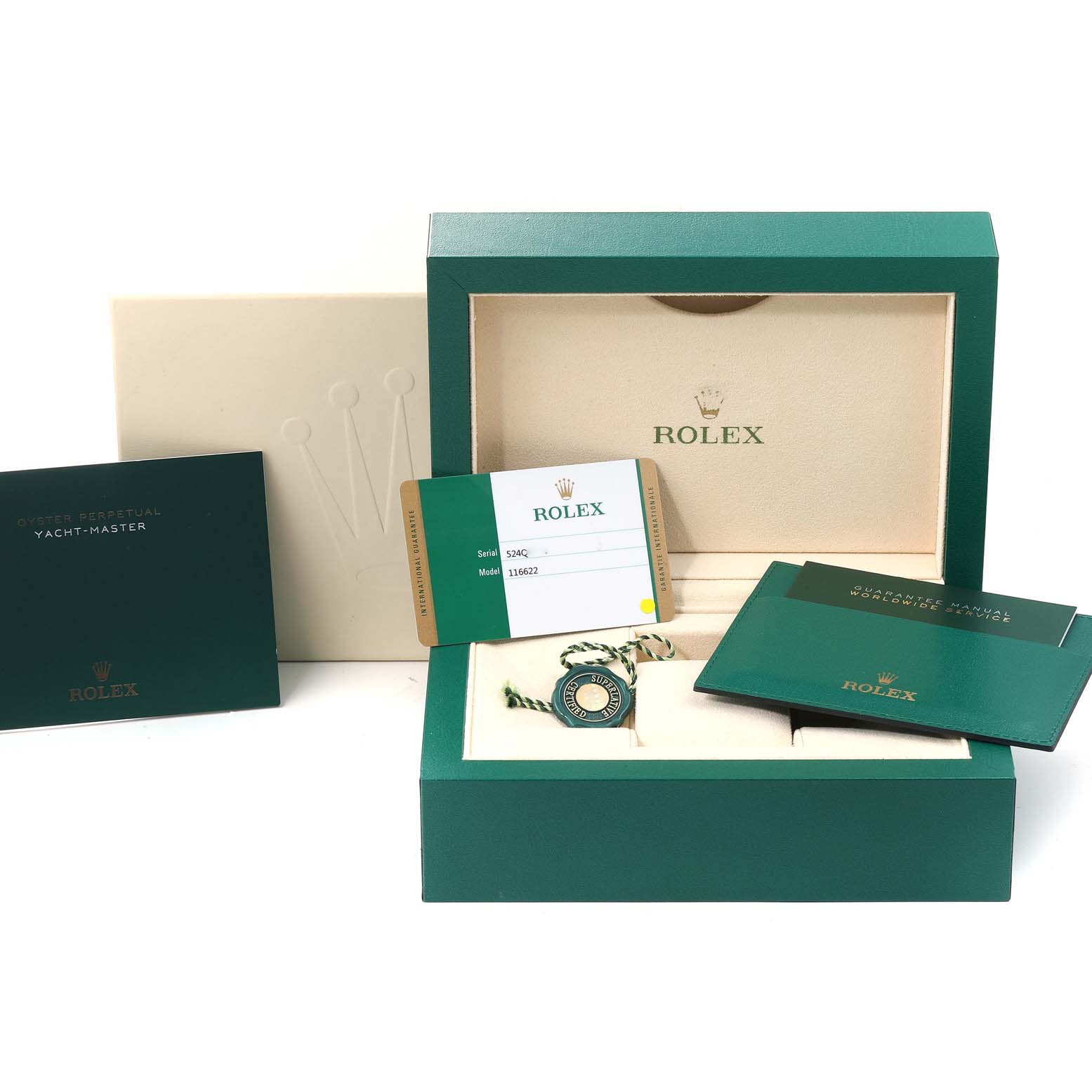This image shows the packaging, warranty card, manual, and accessories of a Rolex Yacht-Master 116622 Men
s Stainless Steel Blue Dial 116622 Men
s Stainless Steel Blue Dial watch.