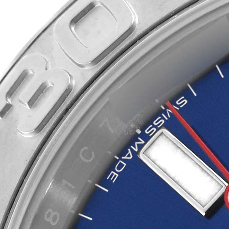 The image shows a close-up of the Rolex Yacht-Master 116622 Men's Stainless Steel Blue Dial 116622 Men's Stainless Steel Blue Dial's bezel, dial, and hour marker, viewed from a side angle.