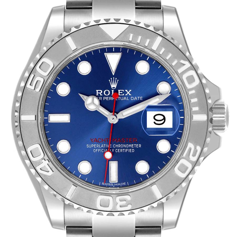 The Rolex Yacht-Master watch is shown from the front, displaying its blue dial, bezel, and part of the stainless steel bracelet.