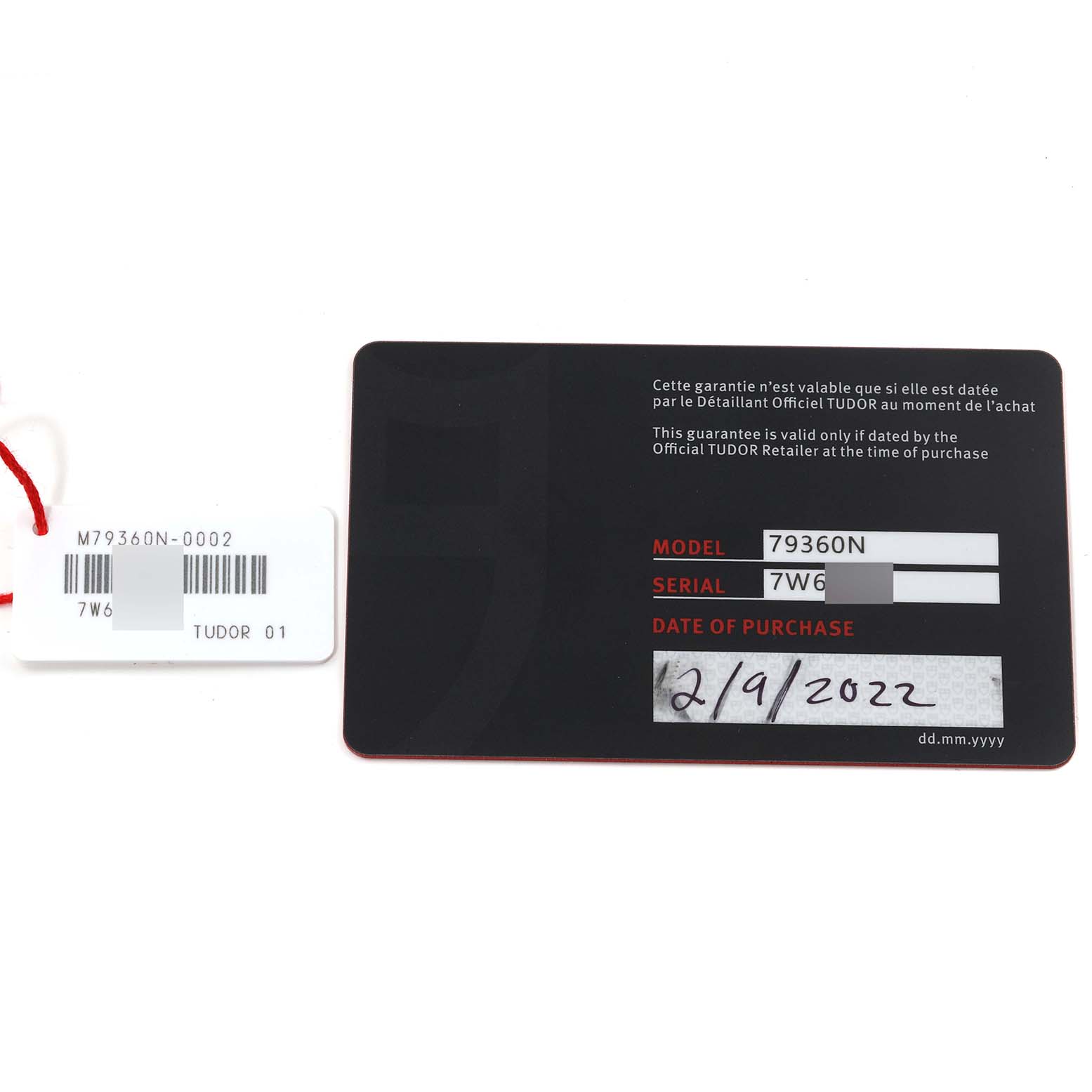 This image shows the warranty card and tag for the Tudor Heritage Black Bay M79360N-0002 Men's Stainless Steel Silver Dial M79360N-0002 Men's Stainless Steel Silver Dial model 79360N.