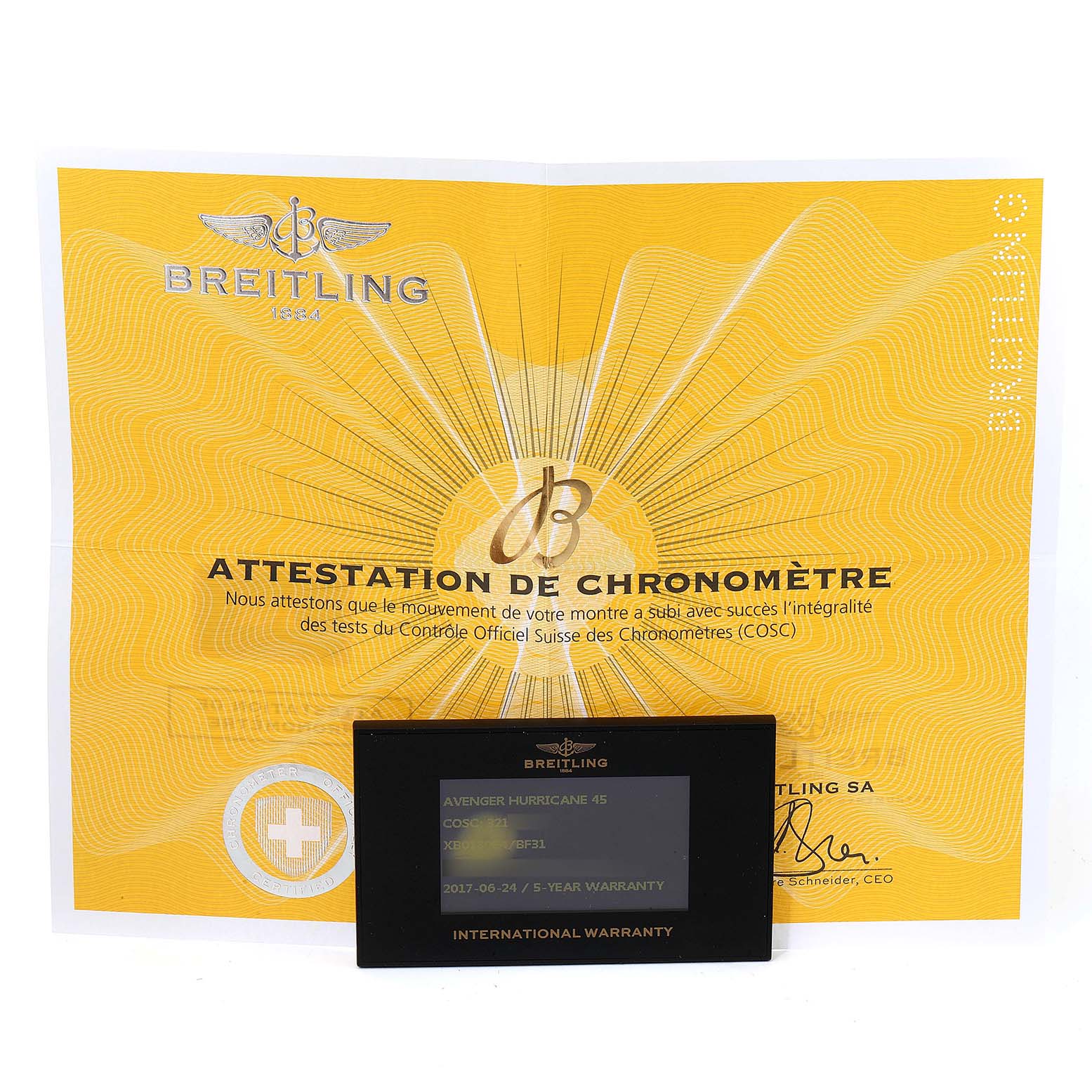 The image shows a Breitling Avenger XB0180E4/BF31 Men's Ceramic Black Dial XB0180E4/BF31 Men's Ceramic Black Dial model's chronometer attestation certificate and international warranty card.