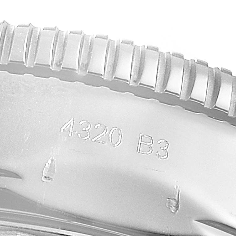 This image shows a close-up of the edge of the bezel and engraving on a Breitling Superocean AB2010 Men's Stainless Steel Black Dial AB2010 Men's Stainless Steel Black Dial watch.
