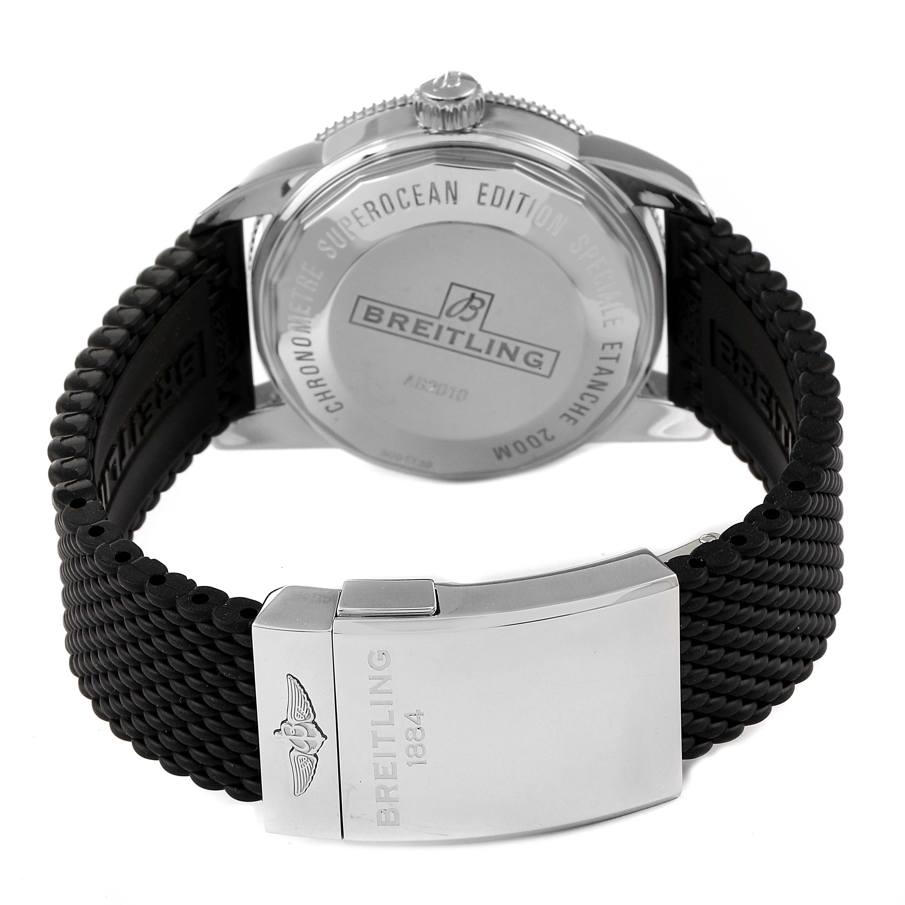 The image shows the back and clasp of a Breitling Superocean AB2010 Men's Stainless Steel Black Dial AB2010 Men's Stainless Steel Black Dial model watch, highlighting the case back and woven strap.