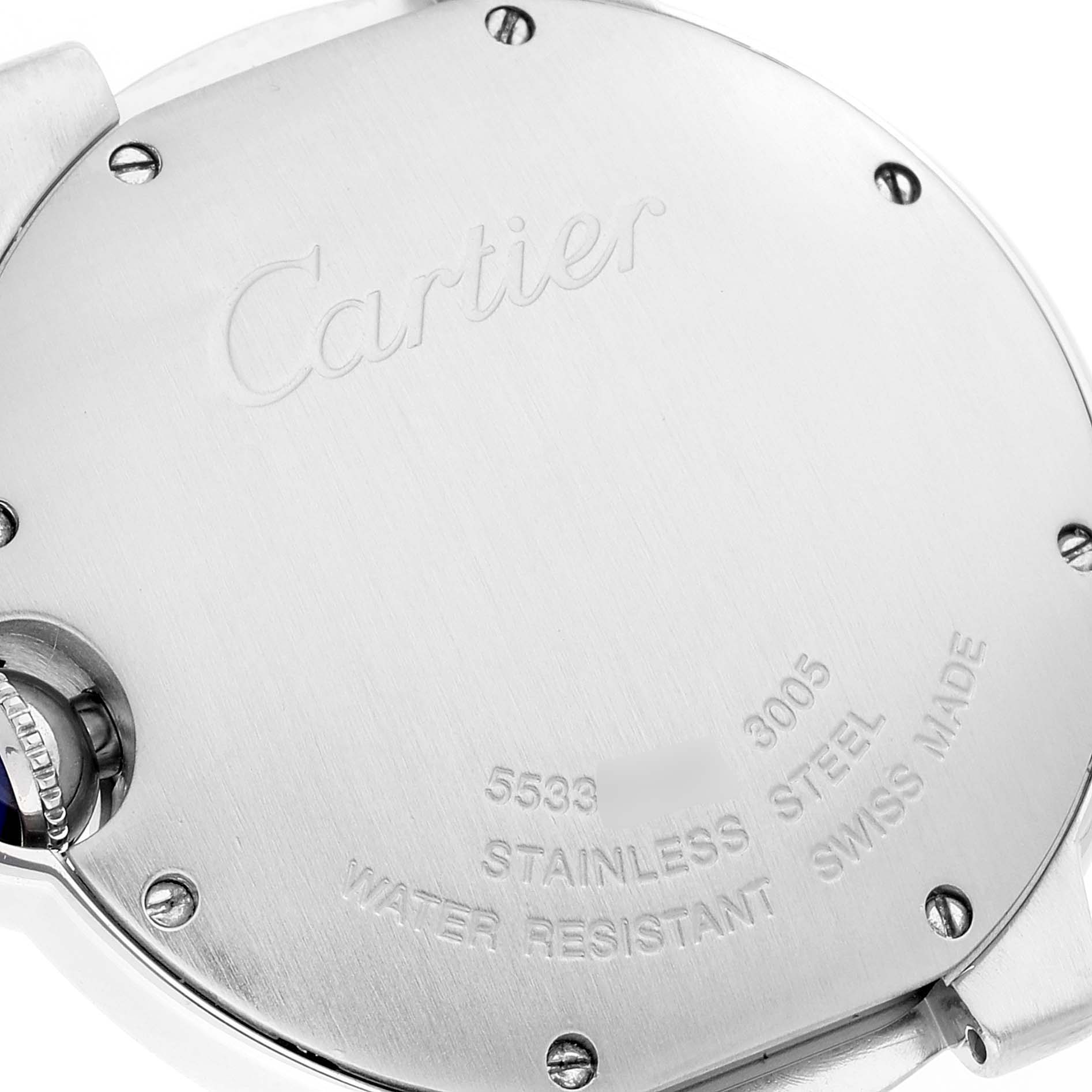 The image shows the back of a Cartier Ballon Bleu W69011Z4 Men's Stainless Steel Silver Dial W69011Z4 Men's Stainless Steel Silver Dial watch, highlighting the engraved inscriptions and screws.
