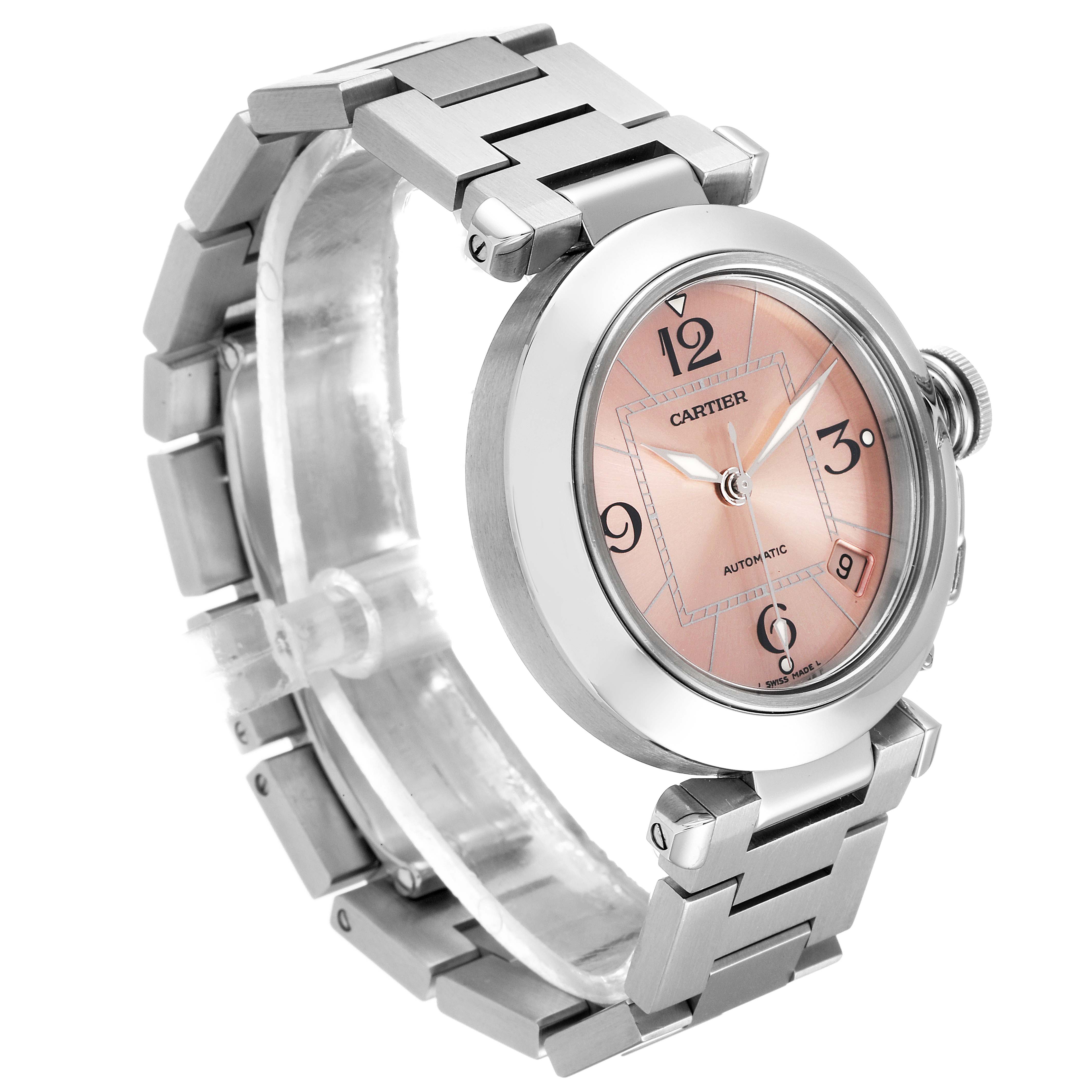 This image shows a Cartier Pasha W31075M7 Women's Stainless Steel Pink Dial W31075M7 Women's Stainless Steel Pink Dial watch at a three-quarter angle, highlighting its face, bezel, metallic strap, and crown.