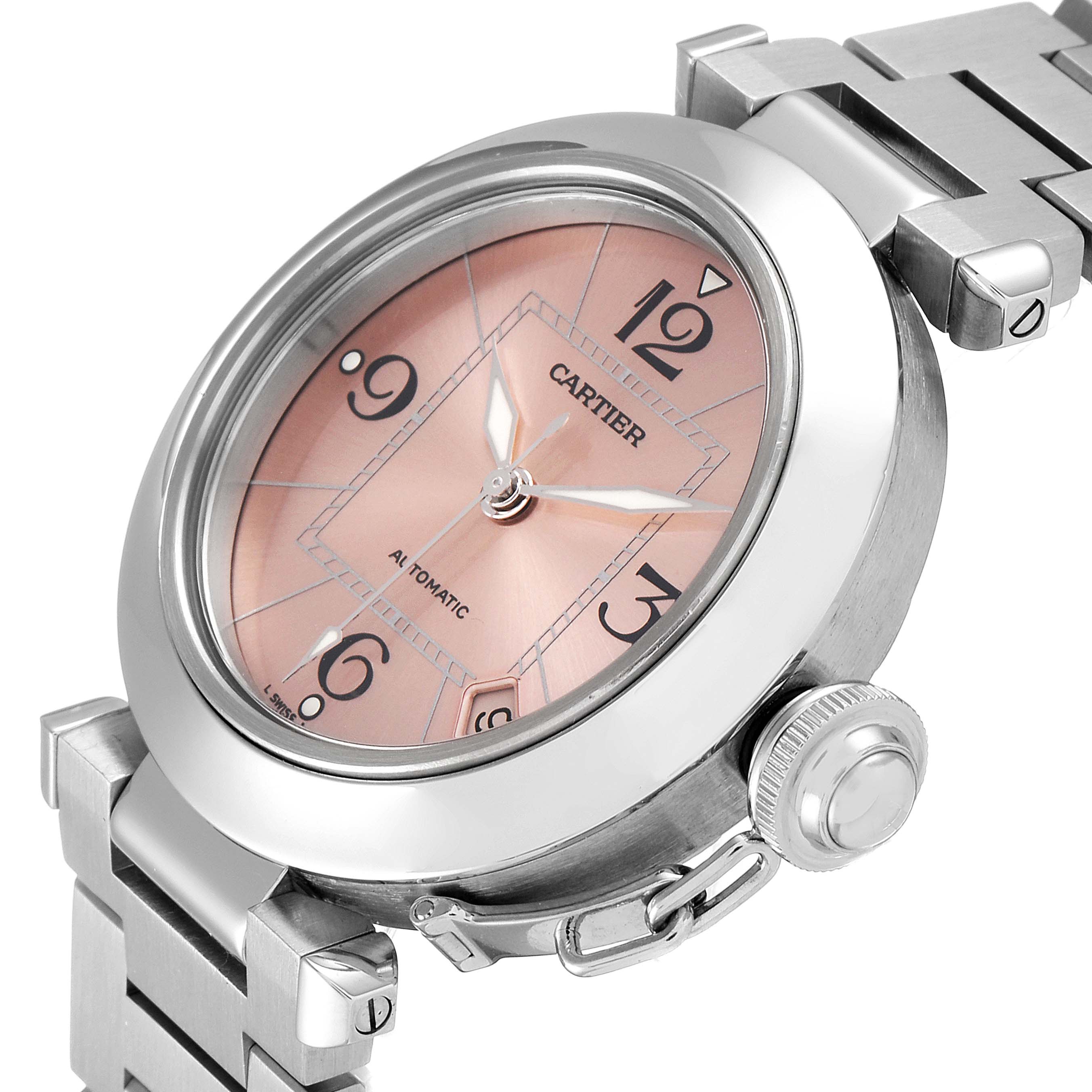 The image shows a side view of a Cartier Pasha W31075M7 Women's Stainless Steel Pink Dial W31075M7 Women's Stainless Steel Pink Dial watch, highlighting its face, bezel, crown, and bracelet.