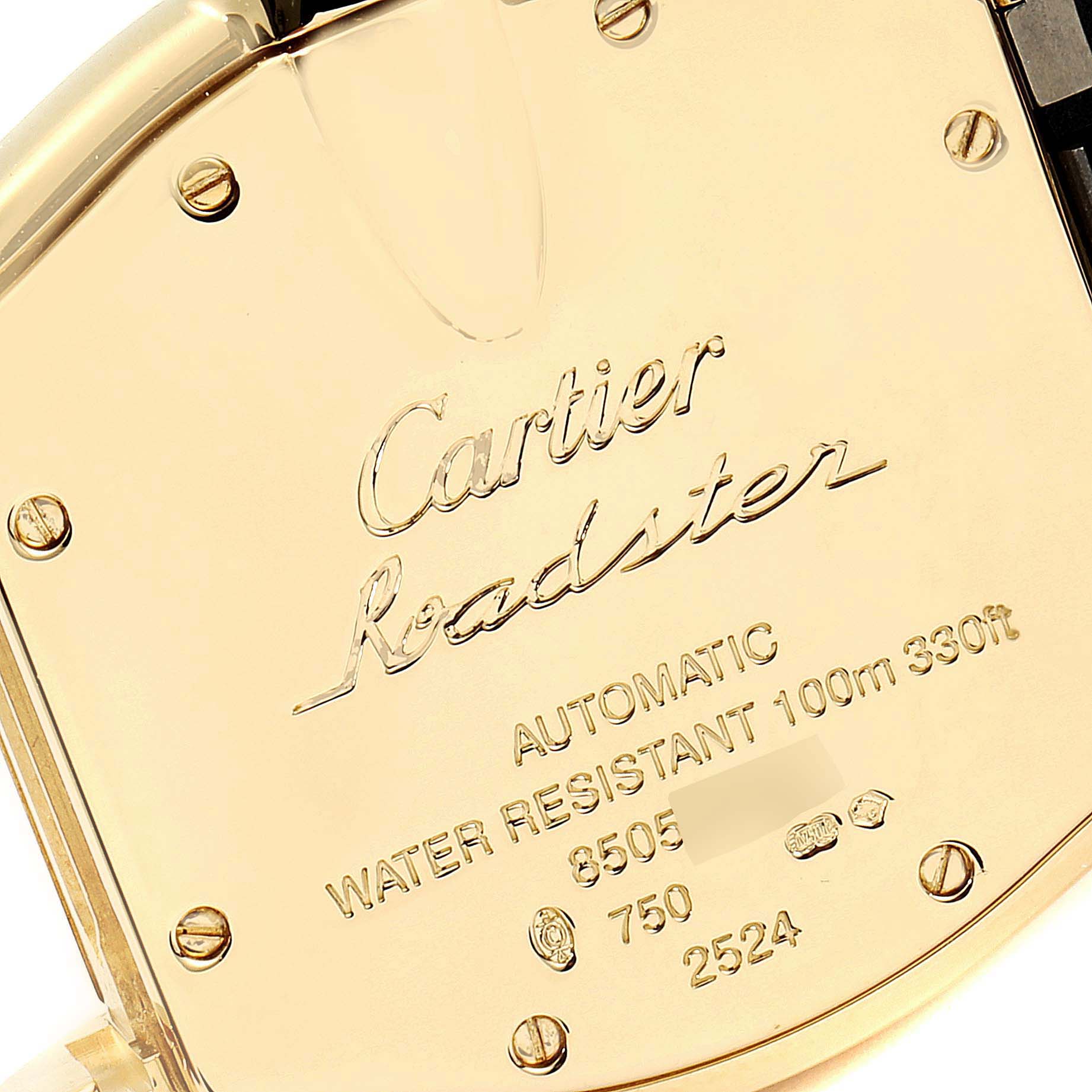 The image shows the back case of the Cartier Roadster W62005V2 Men's Yellow Gold Silver Dial W62005V2 Men's Yellow Gold Silver Dial watch, displaying engraved details and several screws.