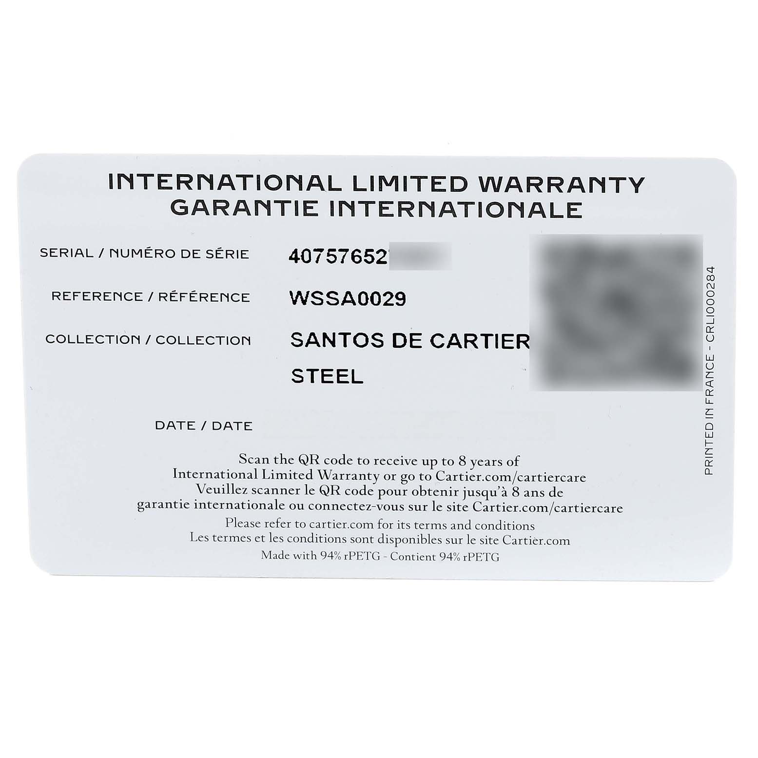 This image shows an international limited warranty card for a Santos de Cartier watch, featuring the model and serial number.