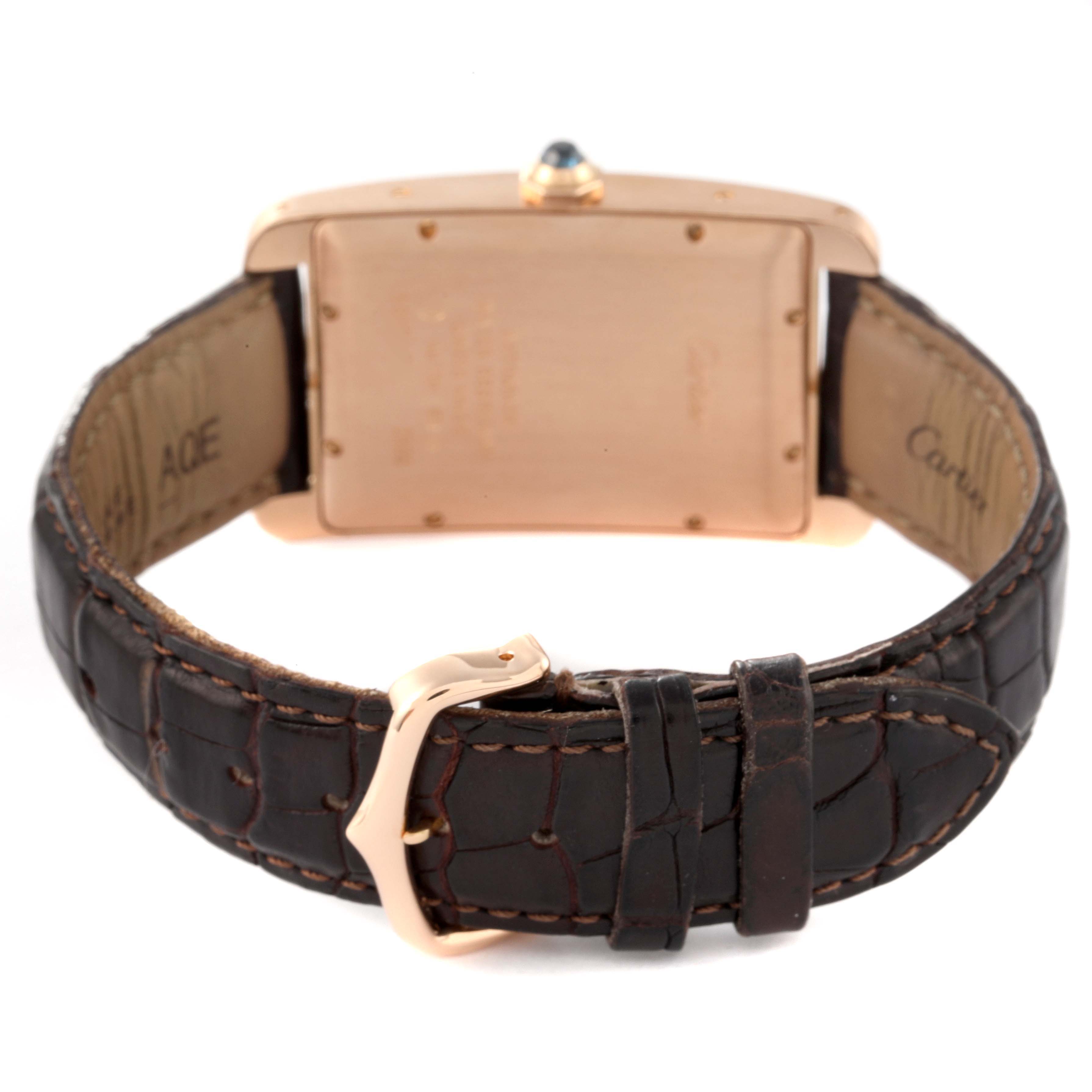 The image shows the back view of a Cartier Tank Americaine W2609156 Men's Rose Gold Silver Dial W2609156 Men's Rose Gold Silver Dial watch with its strap and buckle visible.