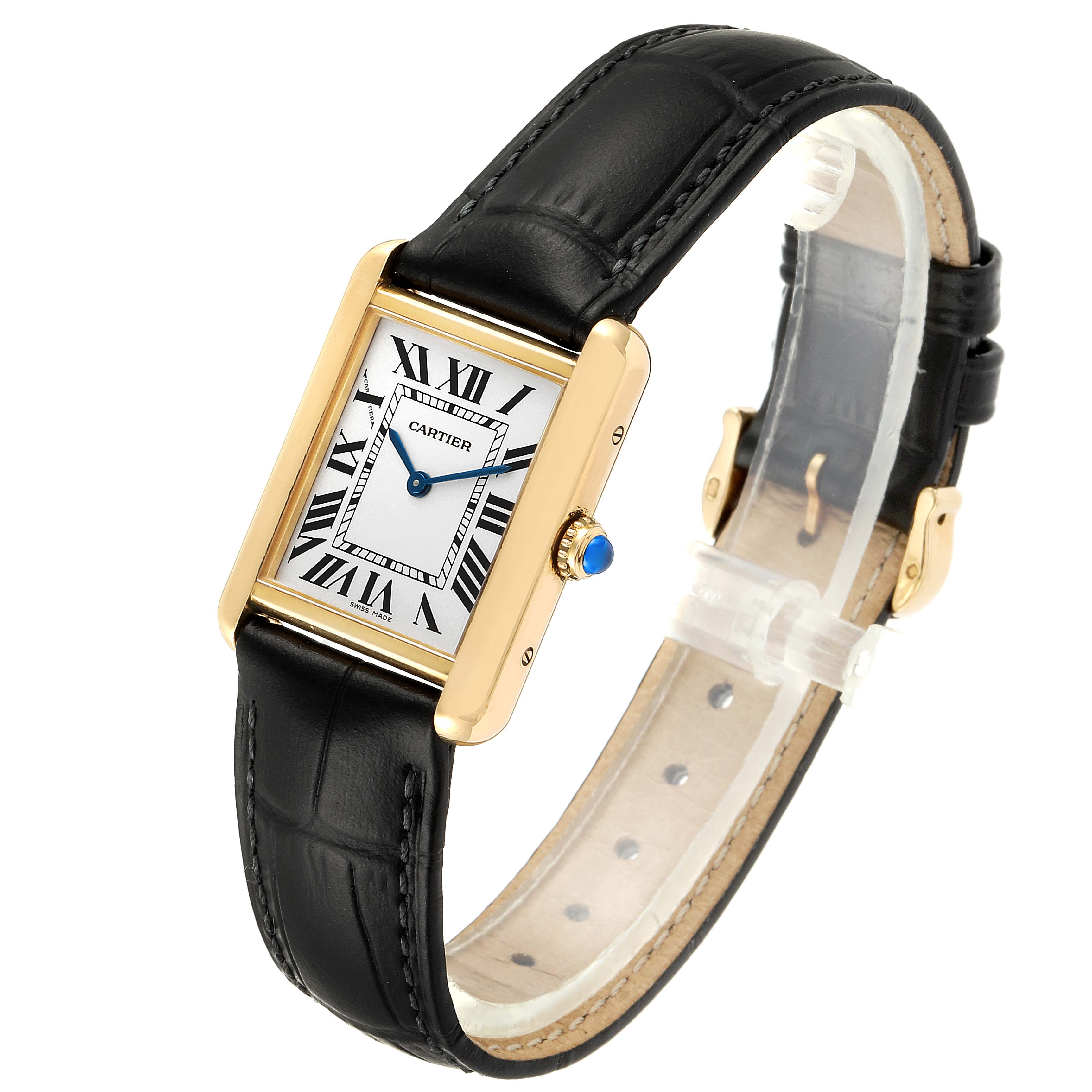 The Tank Solo Cartier watch is shown at an oblique angle, highlighting its rectangular face, Roman numerals, black leather strap, and gold case.