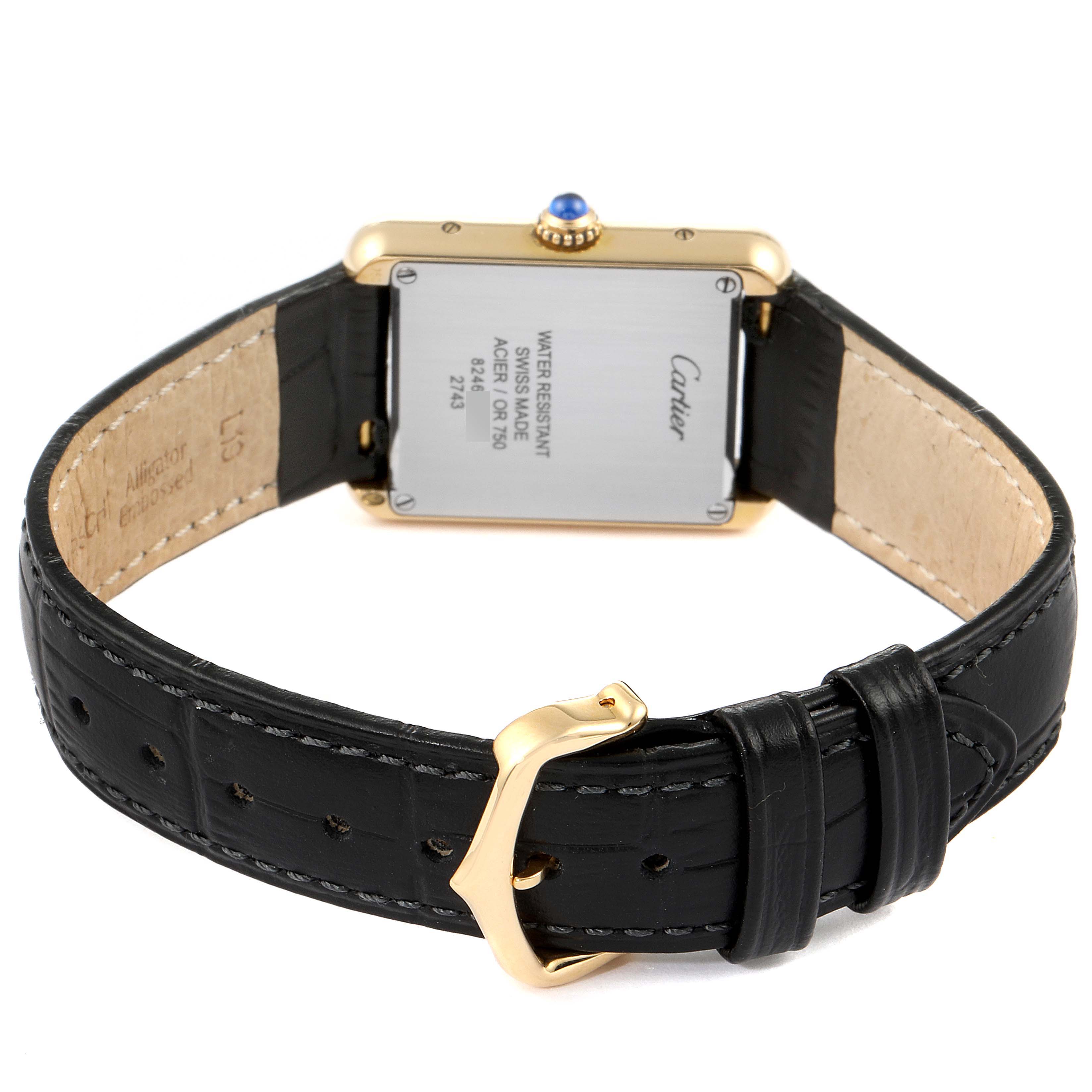 The image shows the back view of a Cartier Tank Solo 290730PL Women
s Yellow Gold Silver Dial 290730PL Women
s Yellow Gold Silver Dial watch, highlighting the case back, crown, and black leather strap with buckle.