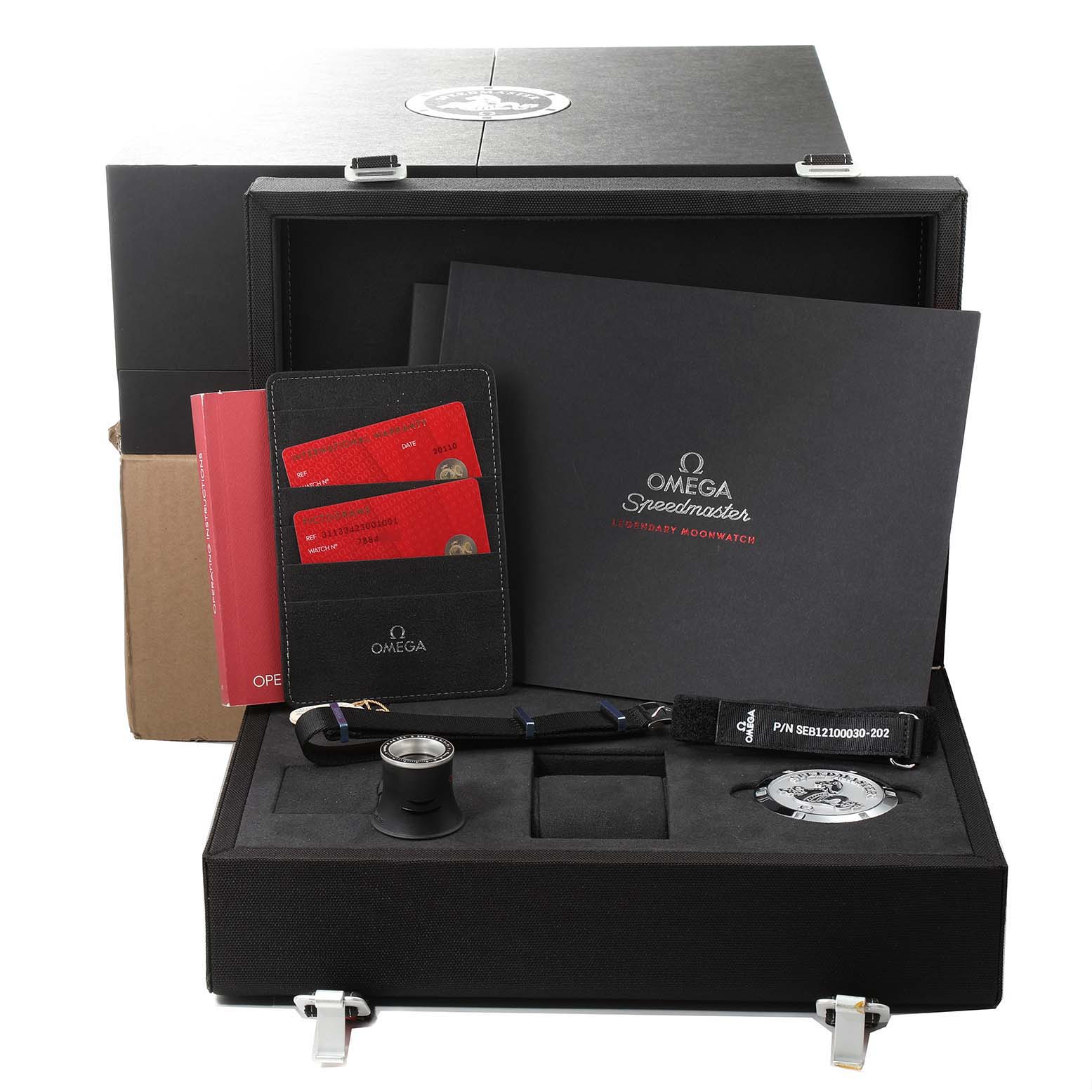 The image shows a complete Omega Speedmaster 311.33.42.30.01.001 Men's Stainless Steel Black Dial 311.33.42.30.01.001 Men's Stainless Steel Black Dial set, including a box, documents, a strap, and accessories, displayed from the front.