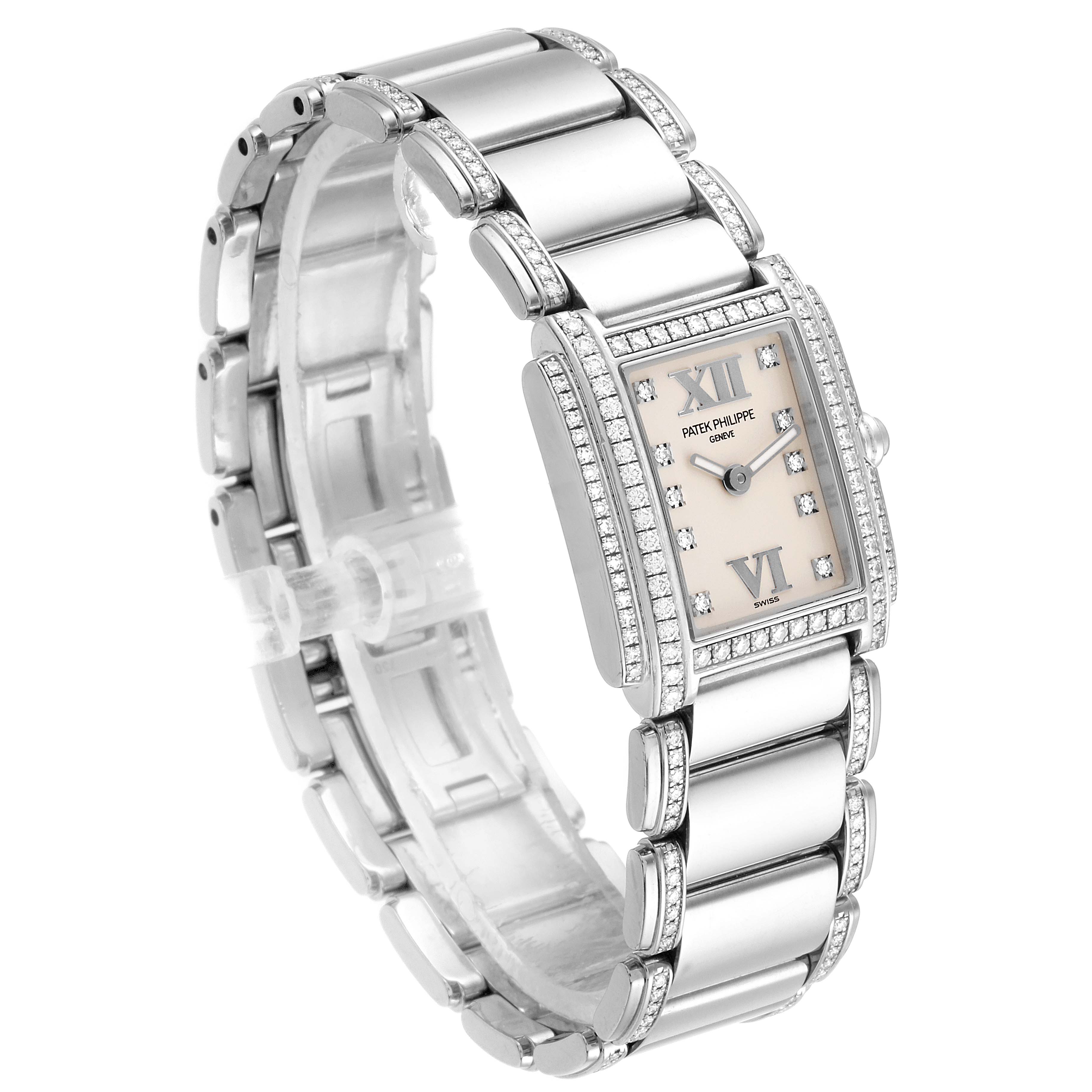 The image shows a Patek Philippe Twenty-4 4908/310G Women's White Gold Silver Dial 4908/310G Women's White Gold Silver Dial watch at a three-quarter angle, highlighting the face, bracelet, and clasp.