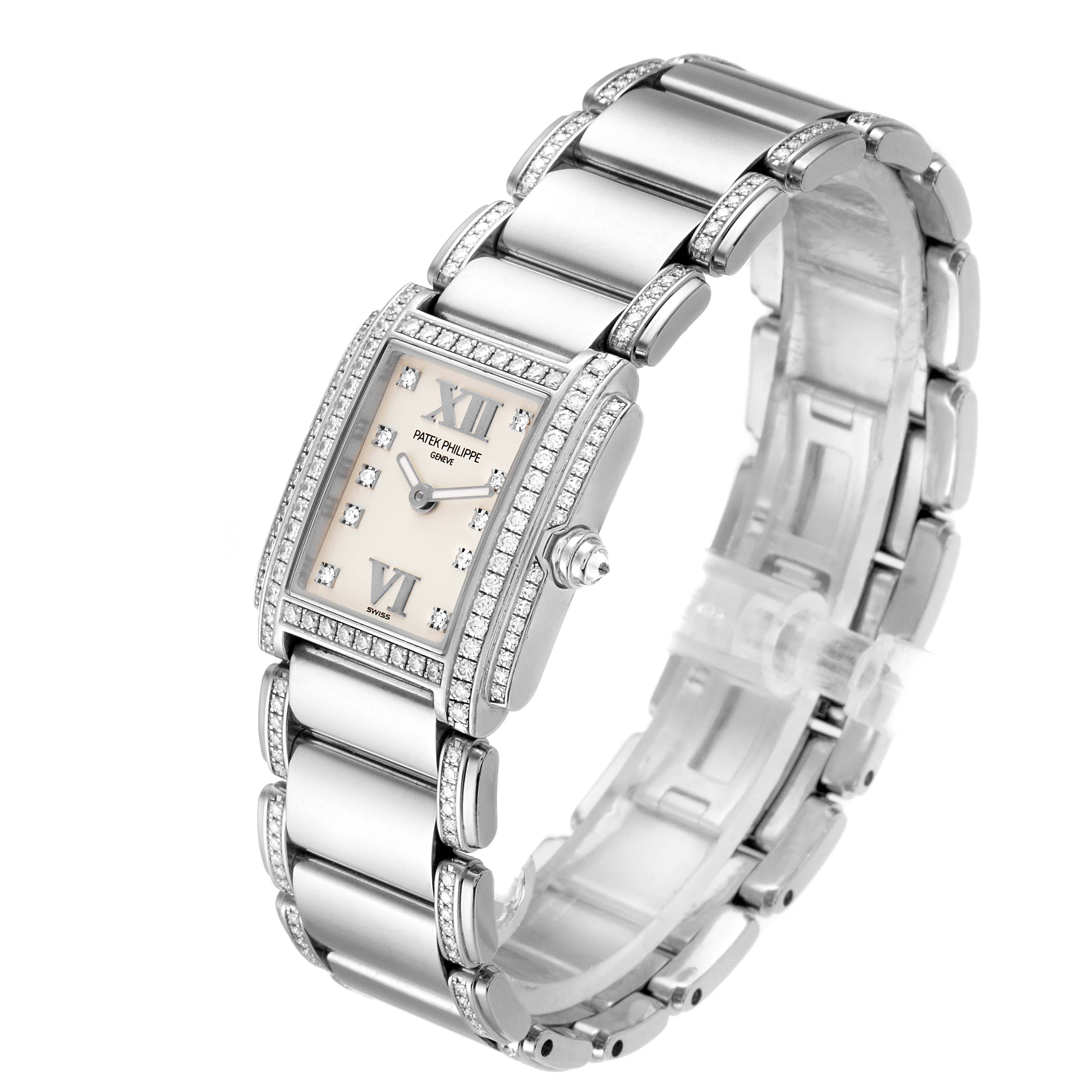 The image shows a Patek Philippe Twenty-4 4908/310G Women's White Gold Silver Dial 4908/310G Women's White Gold Silver Dial watch angled to display the face, bezel, and part of the bracelet.