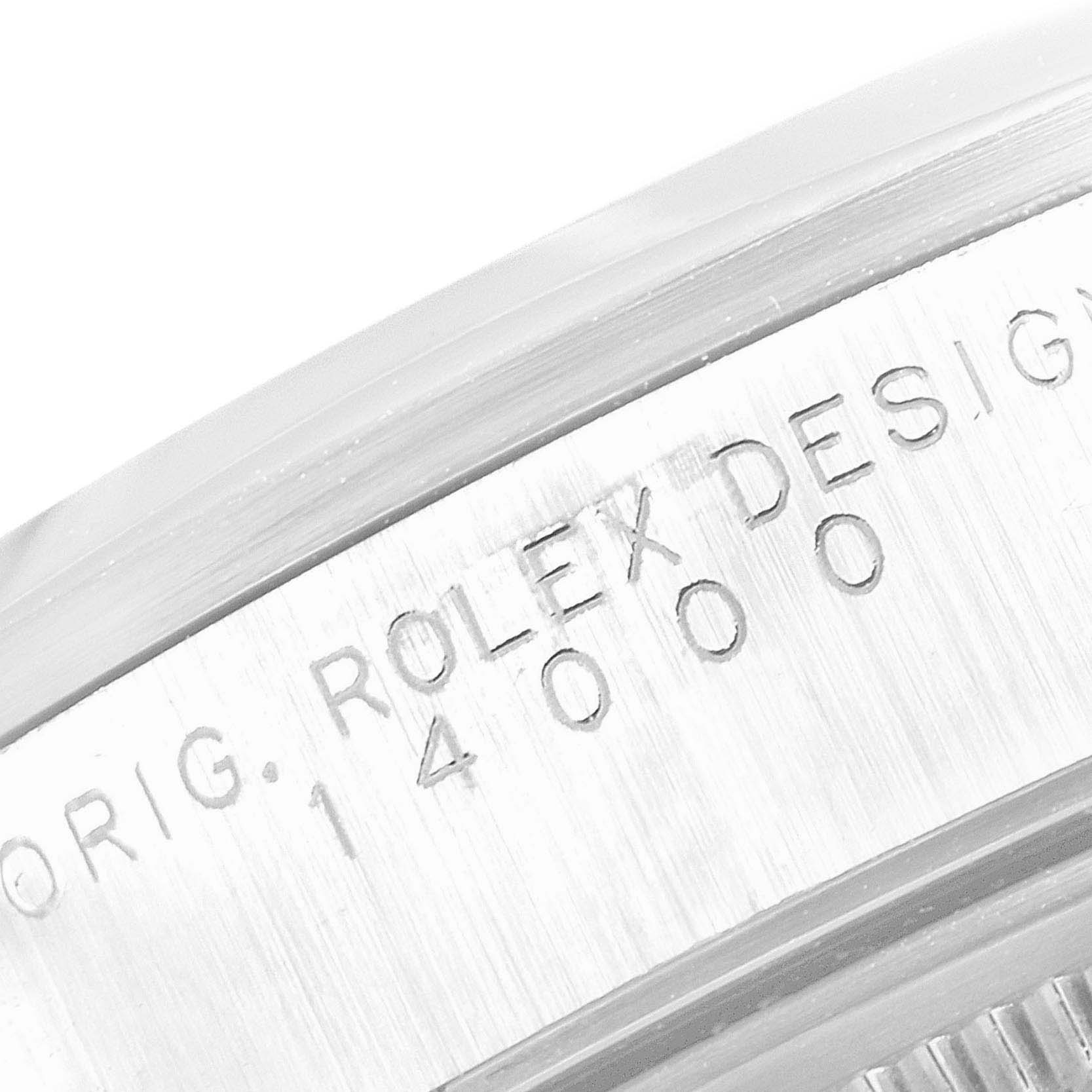 This image shows a close-up of the serial and model number engraving on the case side of a Rolex Air-King 14000 Men's Stainless Steel Silver Dial 14000 Men's Stainless Steel Silver Dial watch.