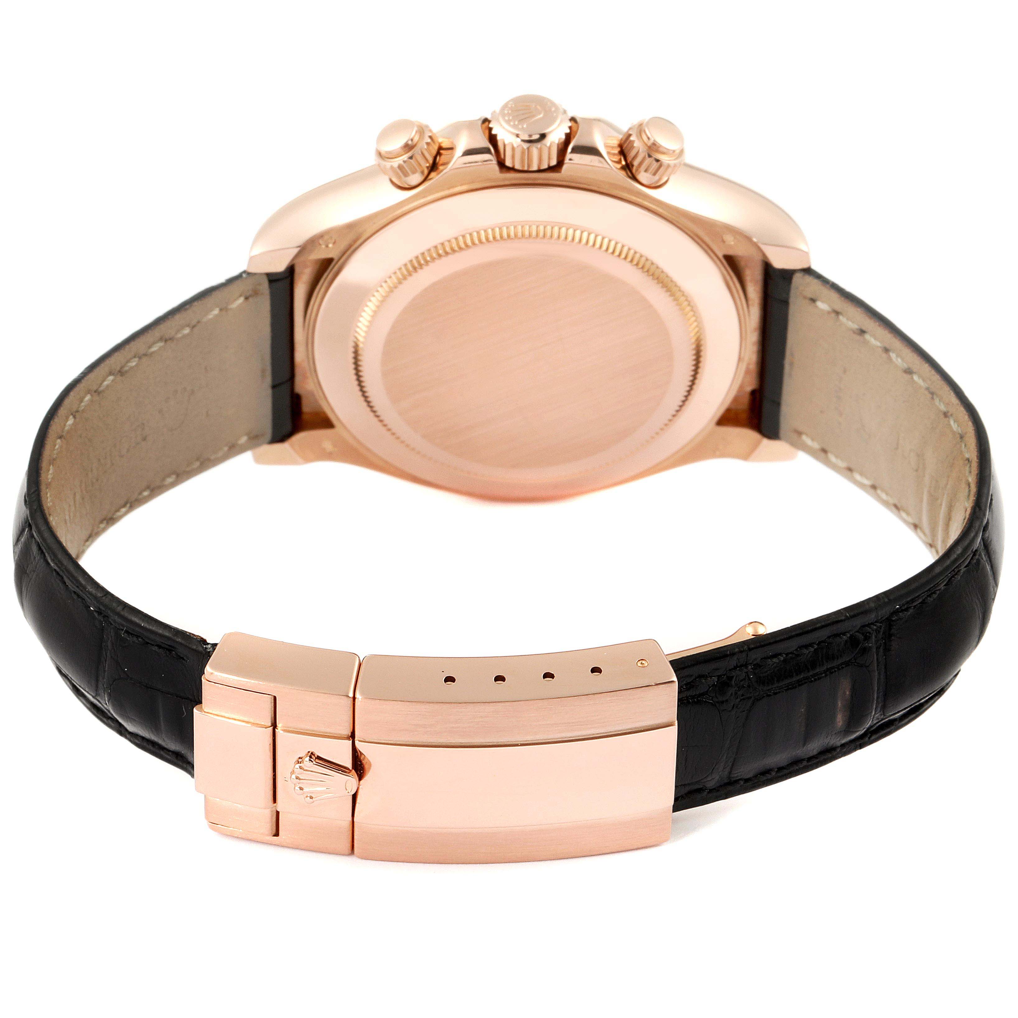 The image shows the back and clasp of a Rolex Daytona 116515 Men's Rose Gold Brown Dial 116515 Men's Rose Gold Brown Dial watch in a gold finish with a black leather strap.