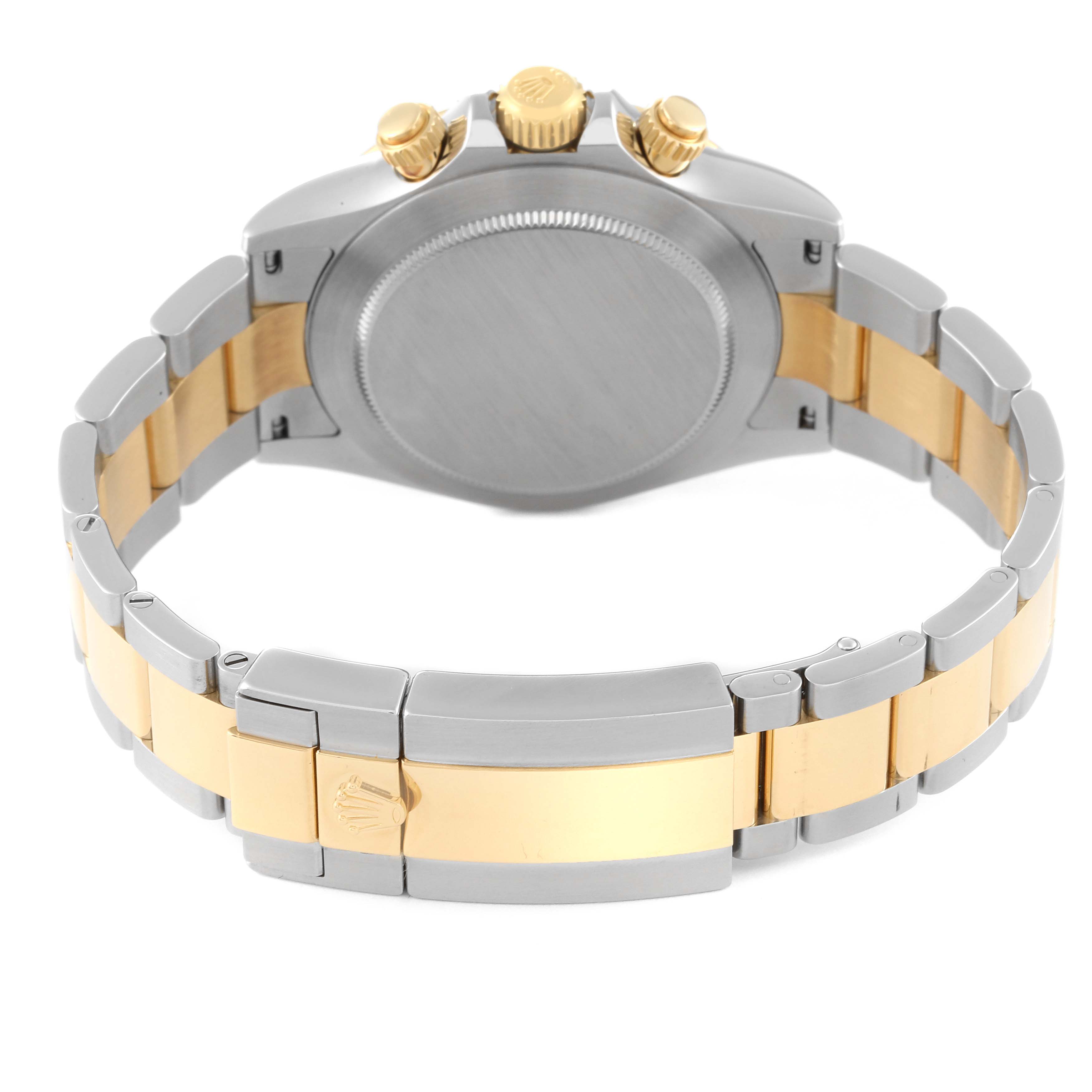 The image shows the back view of a Rolex Daytona 116503 Men
s Steel and Gold (two tone) Black Dial 116503 Men
s Steel and Gold (two tone) Black Dial watch, highlighting the case back, crown, and two-tone bracelet.