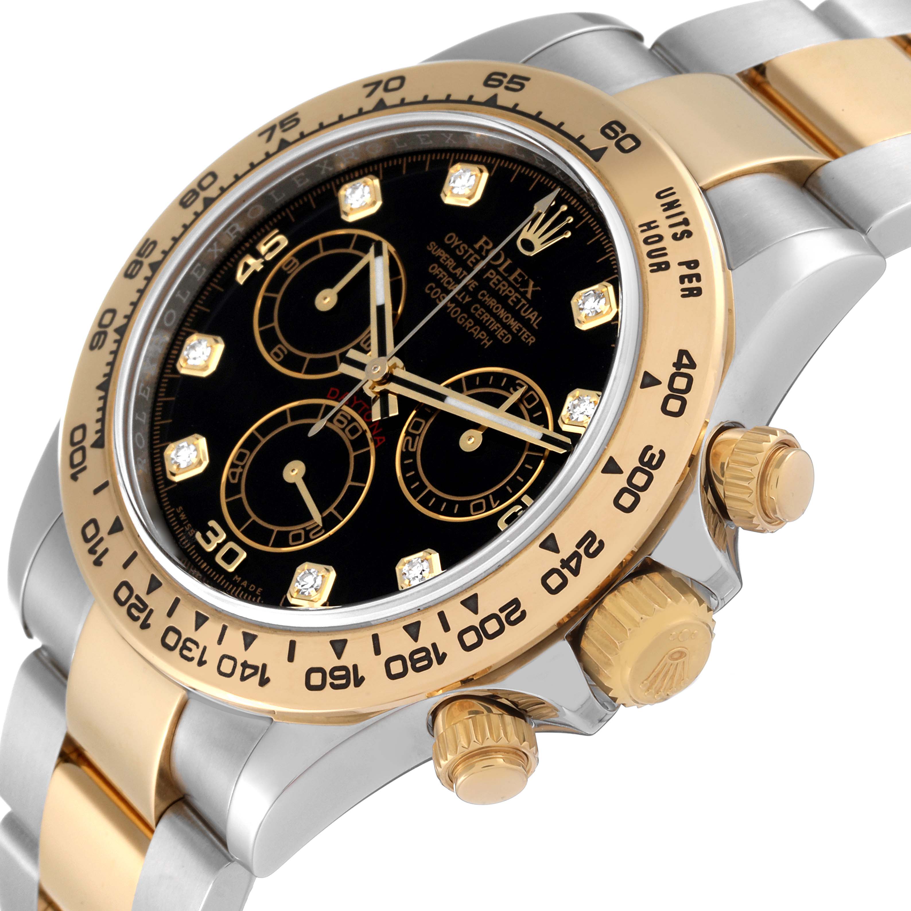 This image shows a close-up of the Rolex Daytona 116503 Men
s Steel and Gold (two tone) Black Dial 116503 Men
s Steel and Gold (two tone) Black Dial watch, highlighting its bezel, dial, and crown from an angled side view.