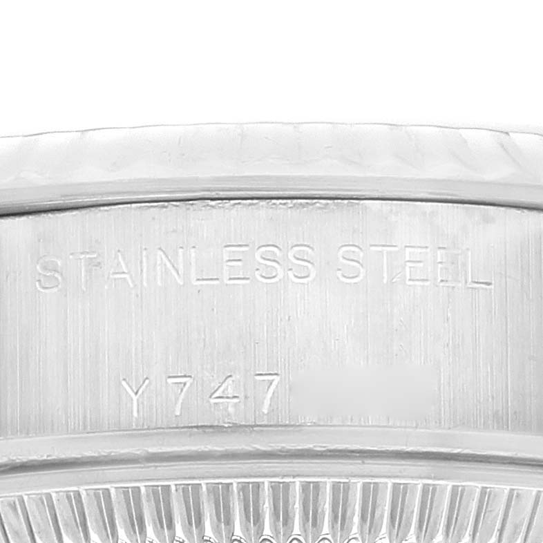 Close-up of the engraved bezel or inner case of a Rolex Datejust 79174 Women's Stainless Steel Silver Dial 79174 Women's Stainless Steel Silver Dial, showing "STAINLESS STEEL" and serial numbers.