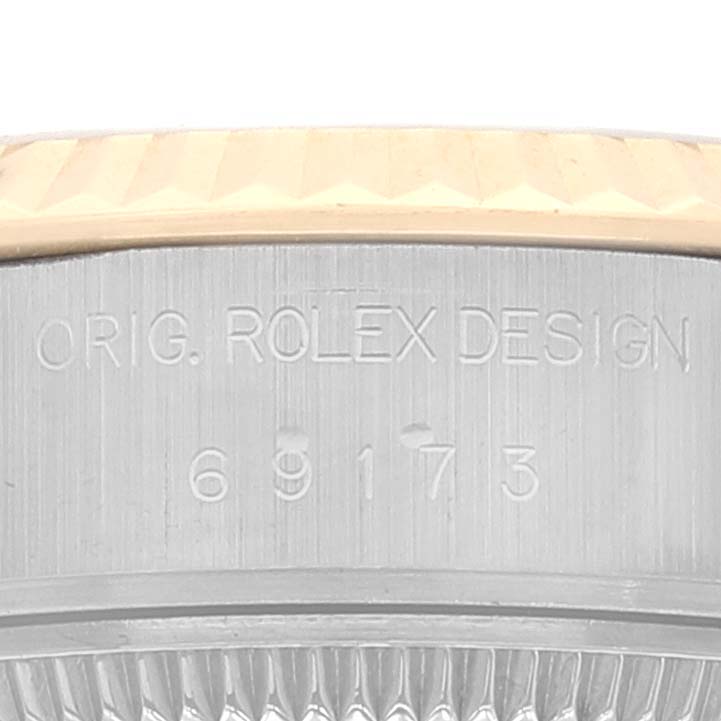 The image shows a close-up of the caseback of a Rolex Datejust 69173 Women's Steel and Gold (two tone) Champagne Dial 69173 Women's Steel and Gold (two tone) Champagne Dial, featuring the model number and "ORIG. ROLEX DESIGN" engraving.