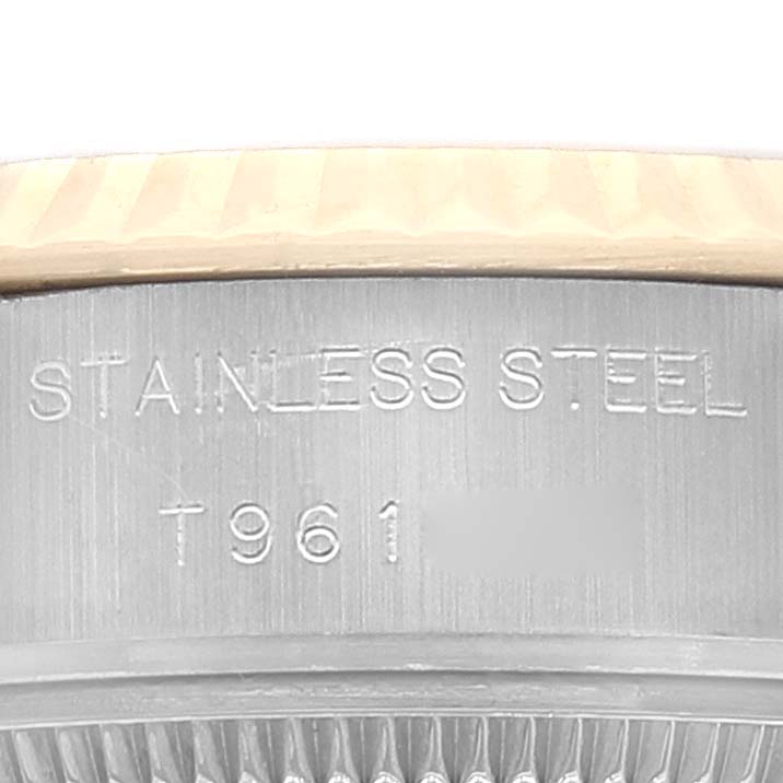 This image shows a close-up of the case side of a Rolex Datejust 69173 Women's Steel and Gold (two tone) Champagne Dial 69173 Women's Steel and Gold (two tone) Champagne Dial, highlighting the stainless steel material and engraved serial number.
