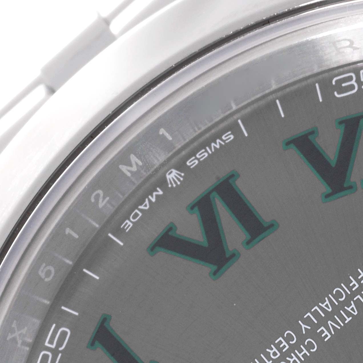 This image shows a close-up of the dial and part of the bezel on a Rolex Datejust 41 126300 Men's Stainless Steel Grey Dial 126300 Men's Stainless Steel Grey Dial, highlighting the "Swiss Made" text and Roman numerals.