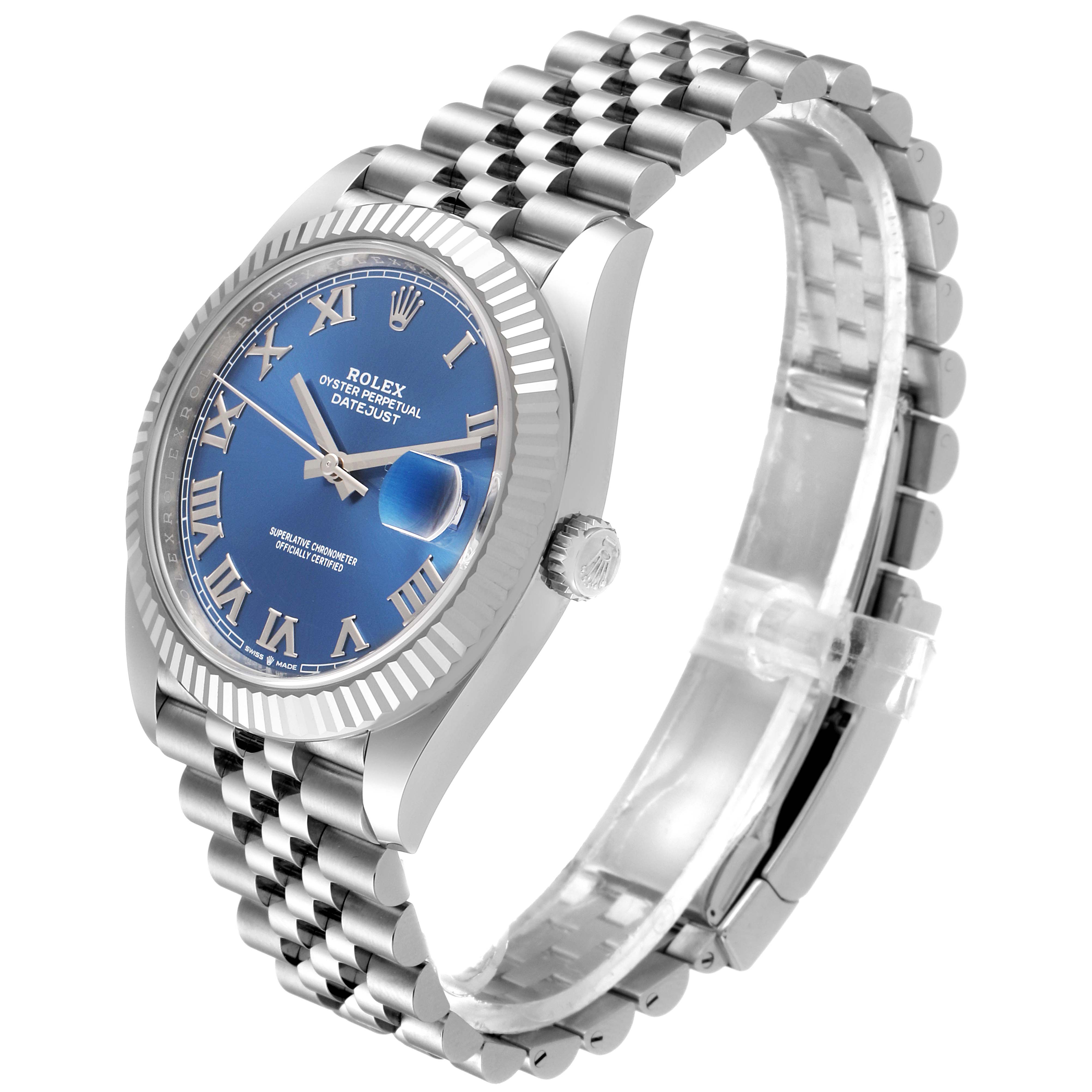This Rolex Datejust 41 126334 Men
s Stainless Steel Blue Dial 126334 Men
s Stainless Steel Blue Dial watch is shown at a side angle, displaying its blue dial, fluted bezel, and Jubilee bracelet.