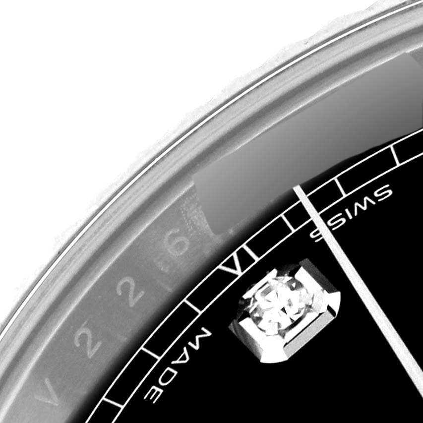 This close-up image of the Rolex Datejust 41 126334 Men
s Stainless Steel Black Dial 126334 Men
s Stainless Steel Black Dial shows part of the dial, a diamond marker, and the "SWISS MADE" text.