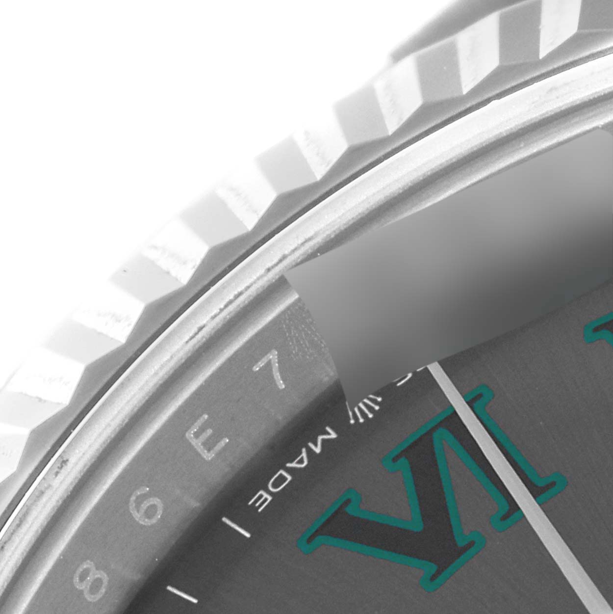 This image shows a close-up of the bezel, part of the dial, and the minute hand of the Rolex Datejust 41 126334 Men's Stainless Steel Grey Dial 126334 Men's Stainless Steel Grey Dial watch.